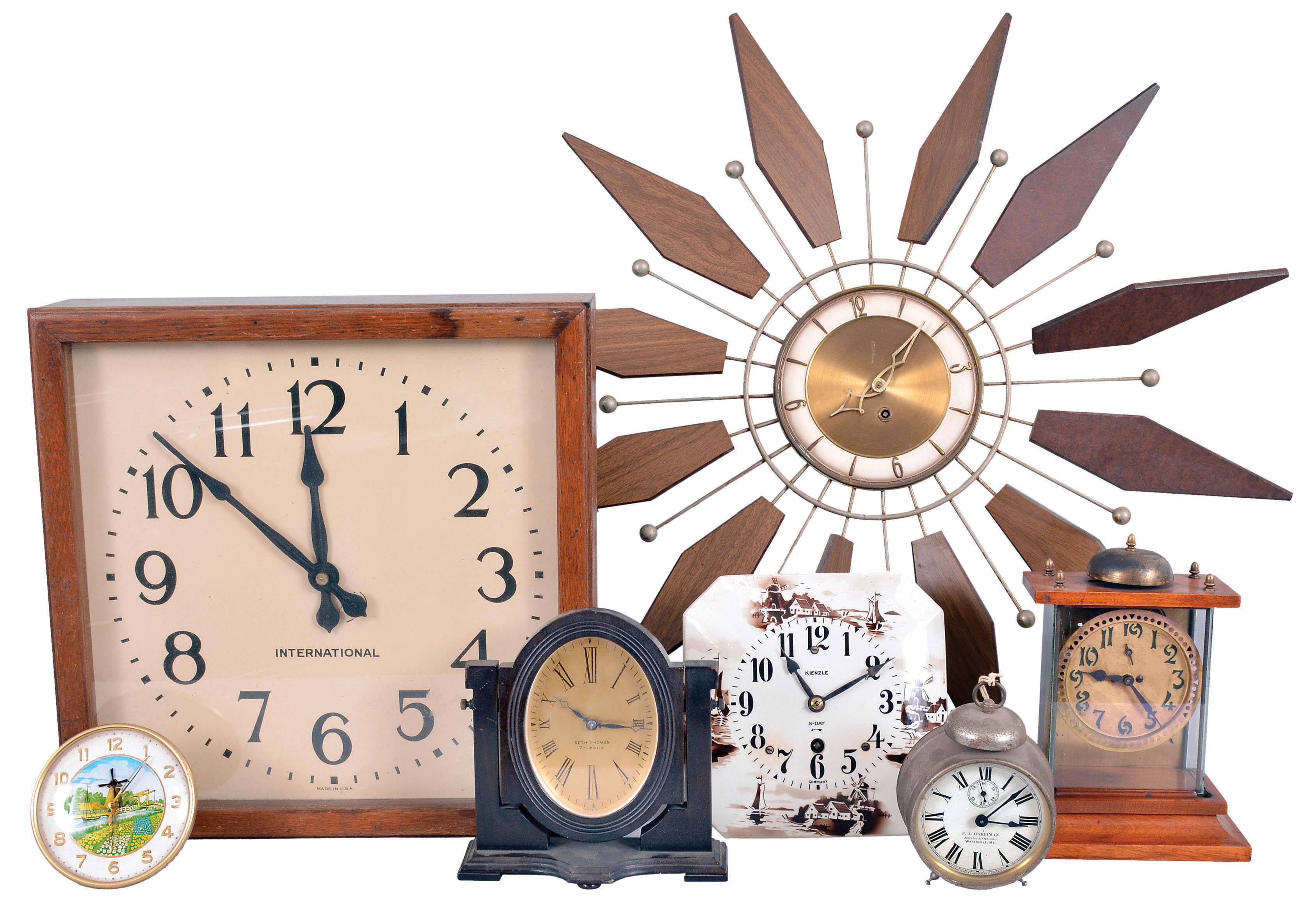 Clocks- 22 (Twenty-two) Assorted Clocks: wide variety of vintage and antique clocks by makers including International, Seth Thomas, Kienzle, Turner, New England Clock Co., New Haven and many others. Lot also includes two cases and one wall bracket. — Antique Clocks Price Guide