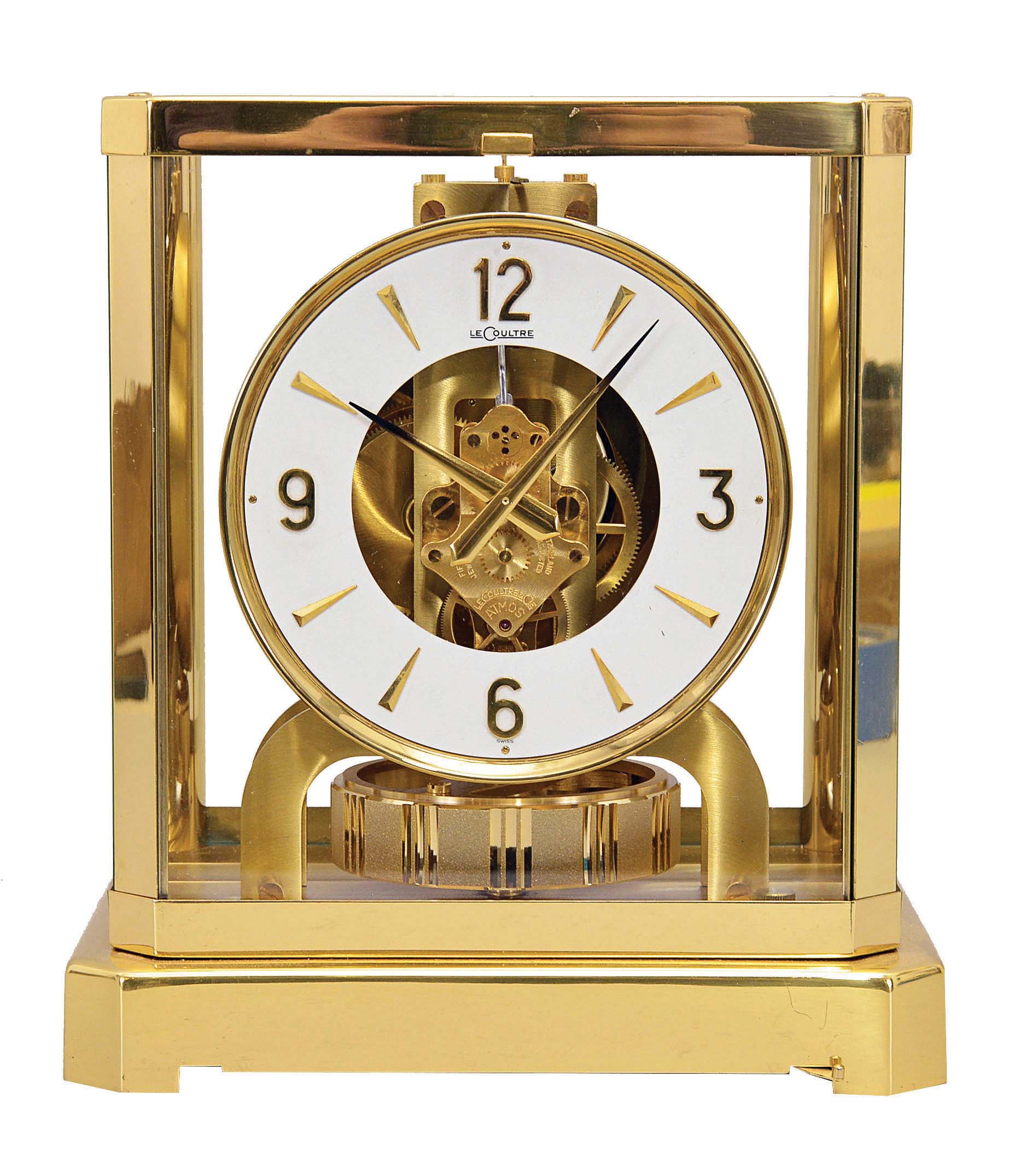 Jaeger- LeCoultre, Switzerland, "Atmos" clock, 15 jewel movement, gilt torsion pendulum, square white painted dial with applied gilt Arabic numerals and arrow markers, gilt hands, all contained in a glazed rectangular case with removable front panel, serial #296852, c1983. — Antique Clocks Price Guide