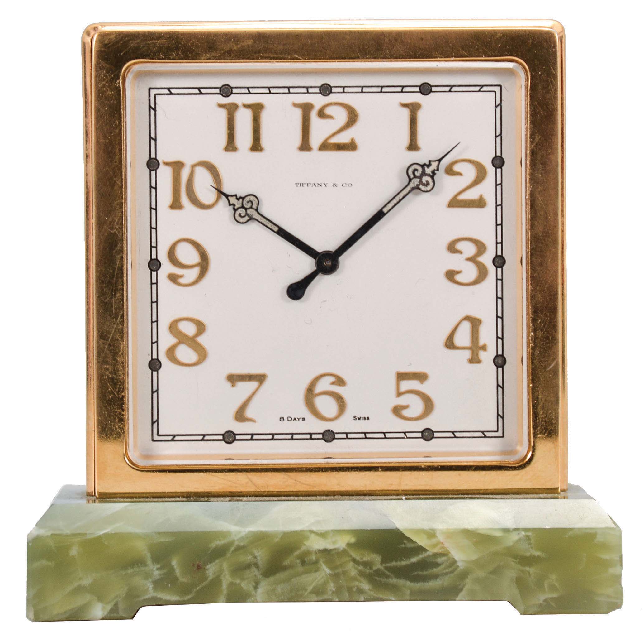 Switzerland, for Tiffany & Co., New York, a two sided desk clock, the rectangular green onyx base supporting the square, gilt case, silvered dials with applied, gilt arabic numerals, luminous black steel hands, 8 day, timepiece movement with lever escapement — Antique Clocks Price Guide