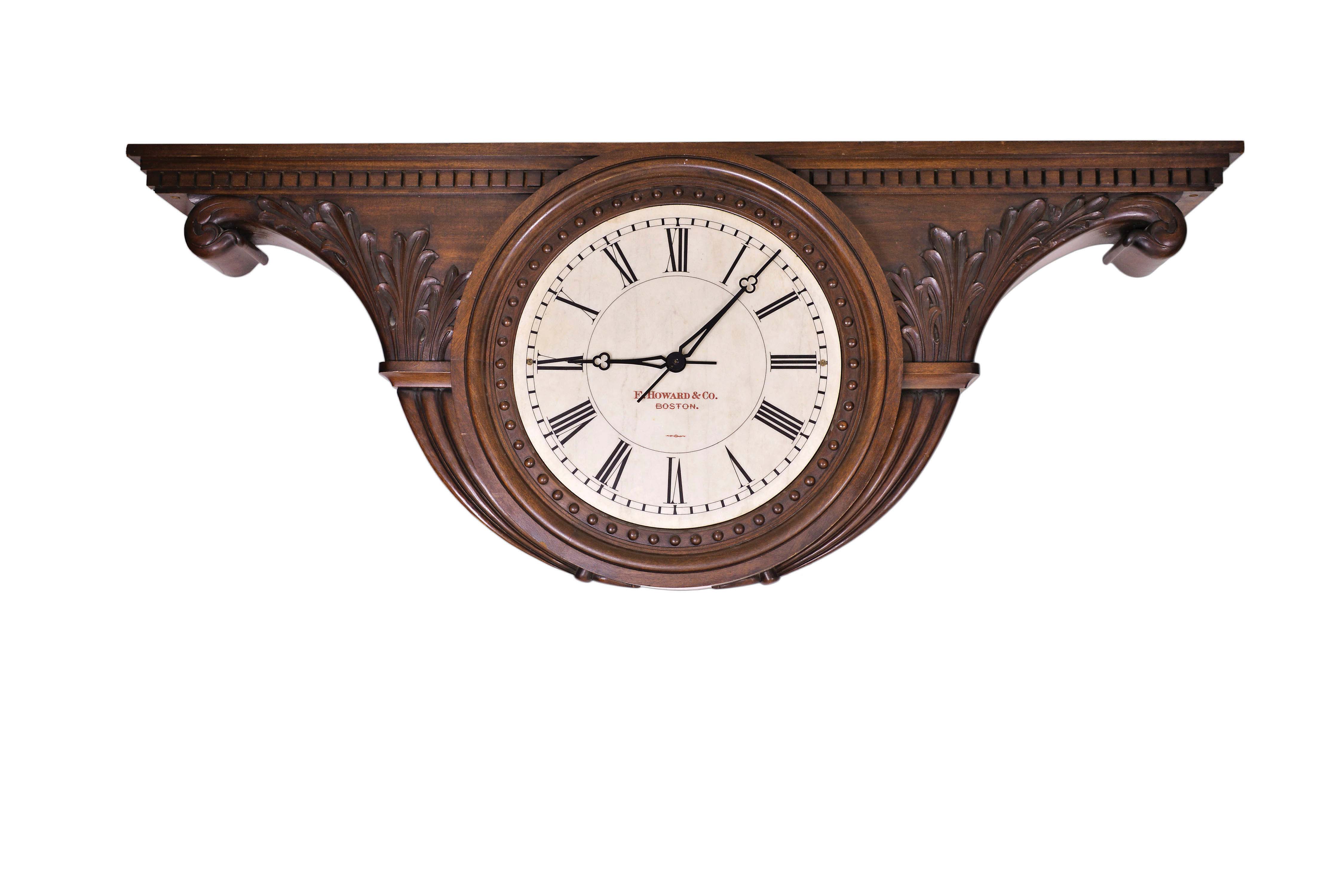 E. Howard & Co., Boston, Mass., monumental double sided ceiling mounted gallery clock, 8 day, time only, weight driven movement in a elaborately carved tambour shaped mahogany case with acanthus leaves, dental molding, small hemispherical ornaments surrounding dials and tapered, fluted raised moldings on sides and bottom of case. The two marble dials are both signed "E. HOWARD & CO. BOSTON". — Antique Clocks Price Guide