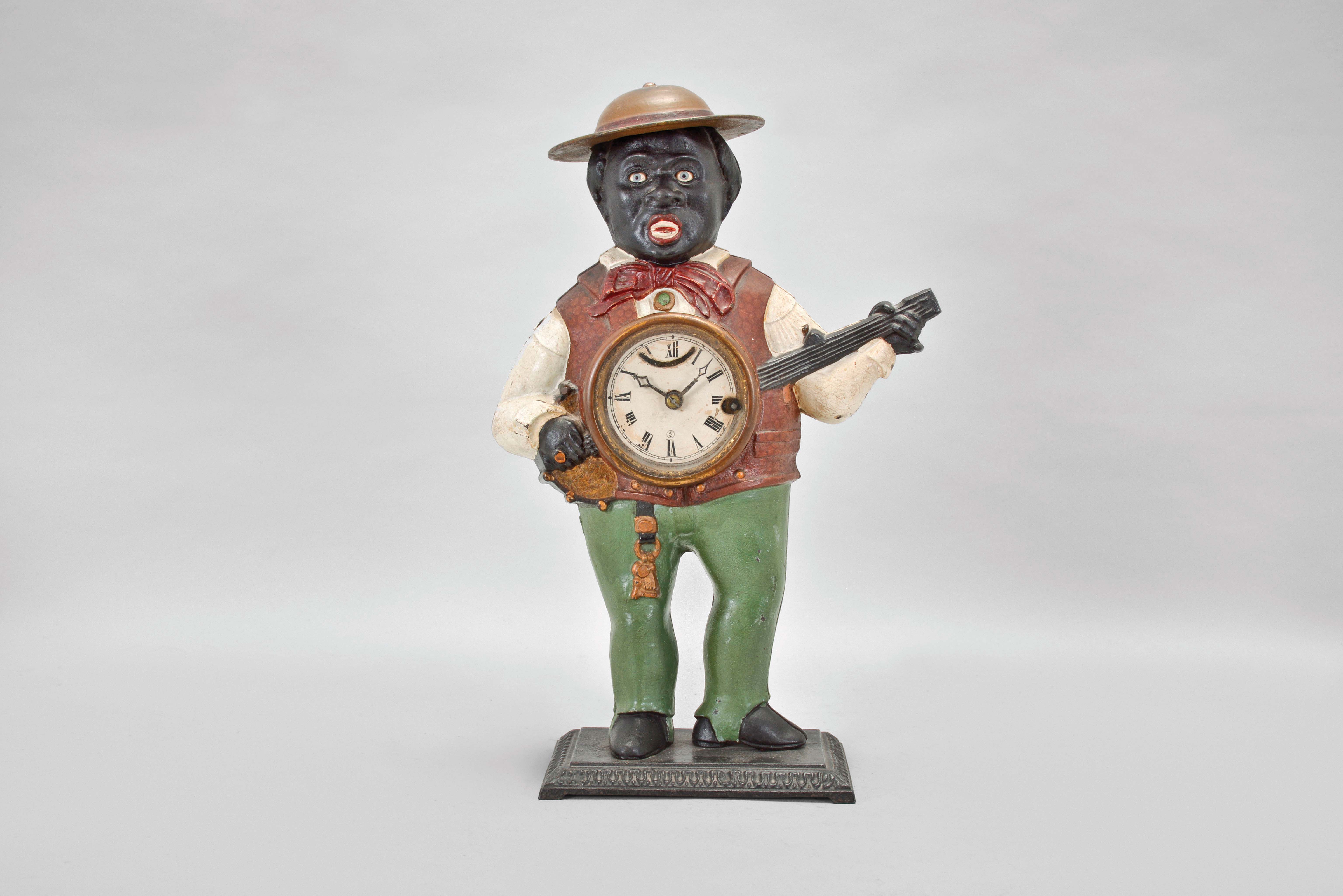 Bradley & Hubbard, Meriden, Conn., "Sambo" blinking eye shelf clock with a spring driven, 30 hour, timepiece with a balance wheel escapement in a painted cast iron case. — Antique Clocks Price Guide