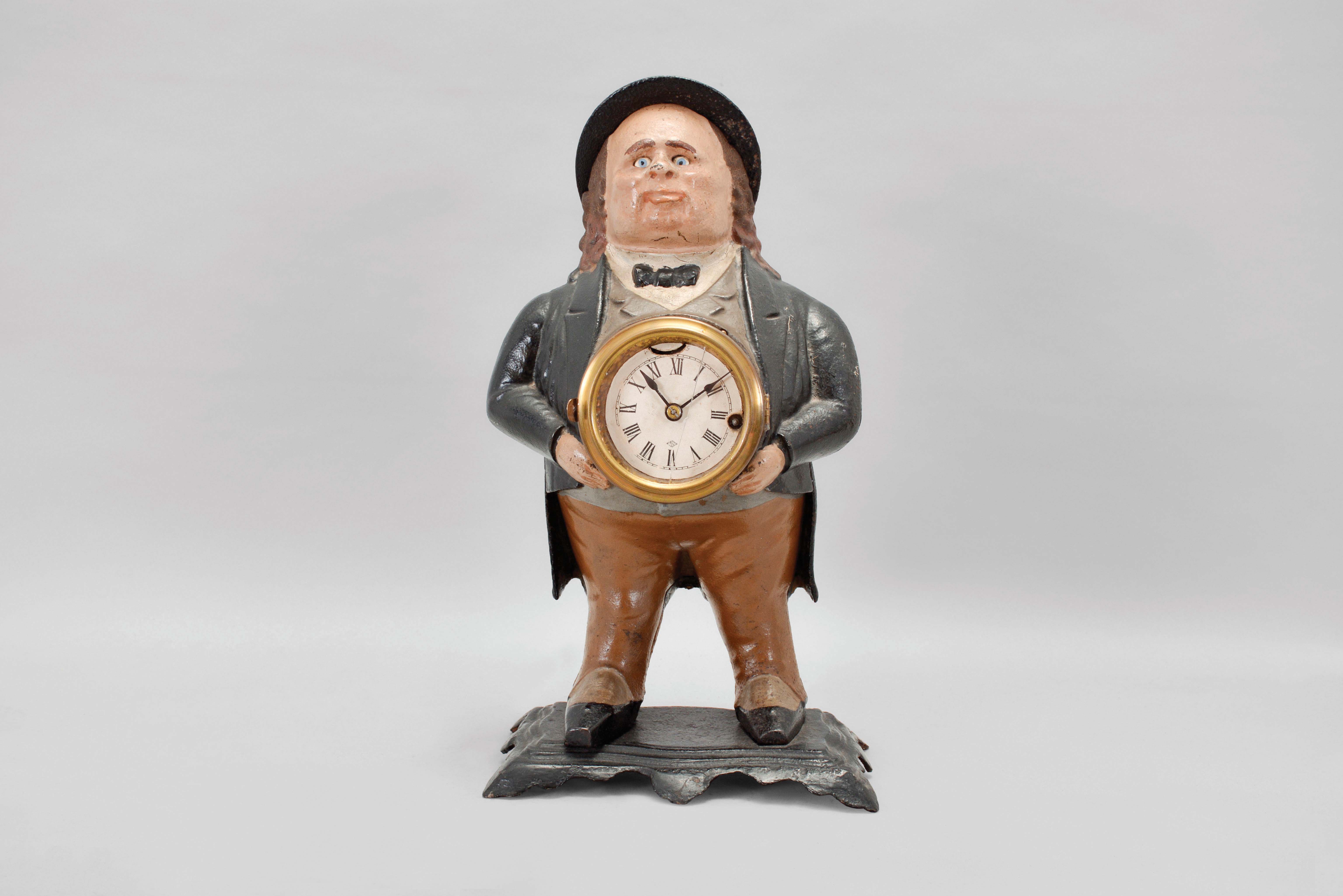 Bradley & Hubbard, Meriden, Conn., "John Bull" blinking eye shelf clock with a spring driven, 30 hour, timepiece with a balance wheel escapement in a painted cast iron case. — Antique Clocks Price Guide