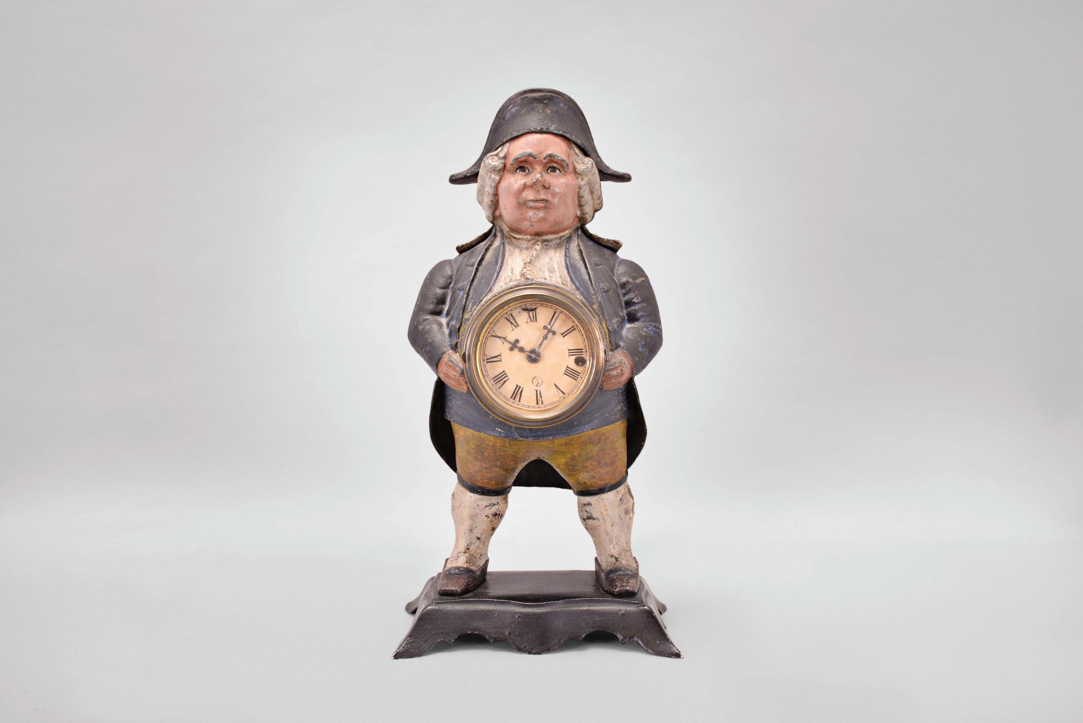 Bradley & Hubbard, Meriden, Conn., "Continental" blinking eye shelf clock with a spring driven, 30 hour, timepiece with a balance wheel escapement in a painted cast iron case. — Antique Clocks Price Guide