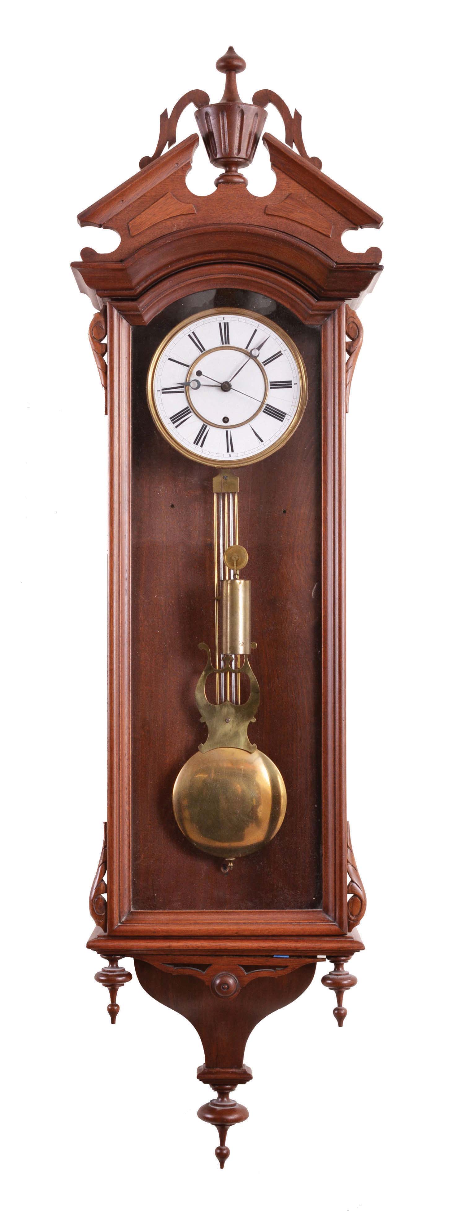 George A. Jones & Co., New York, hanging regulator, 8 day, time only, brass weight driven movement with sweep center seconds in a walnut, Vienna-style regulator case with Roman numeral white enamel dial and gridiron pendulum and brass bob — Antique Clocks Price Guide