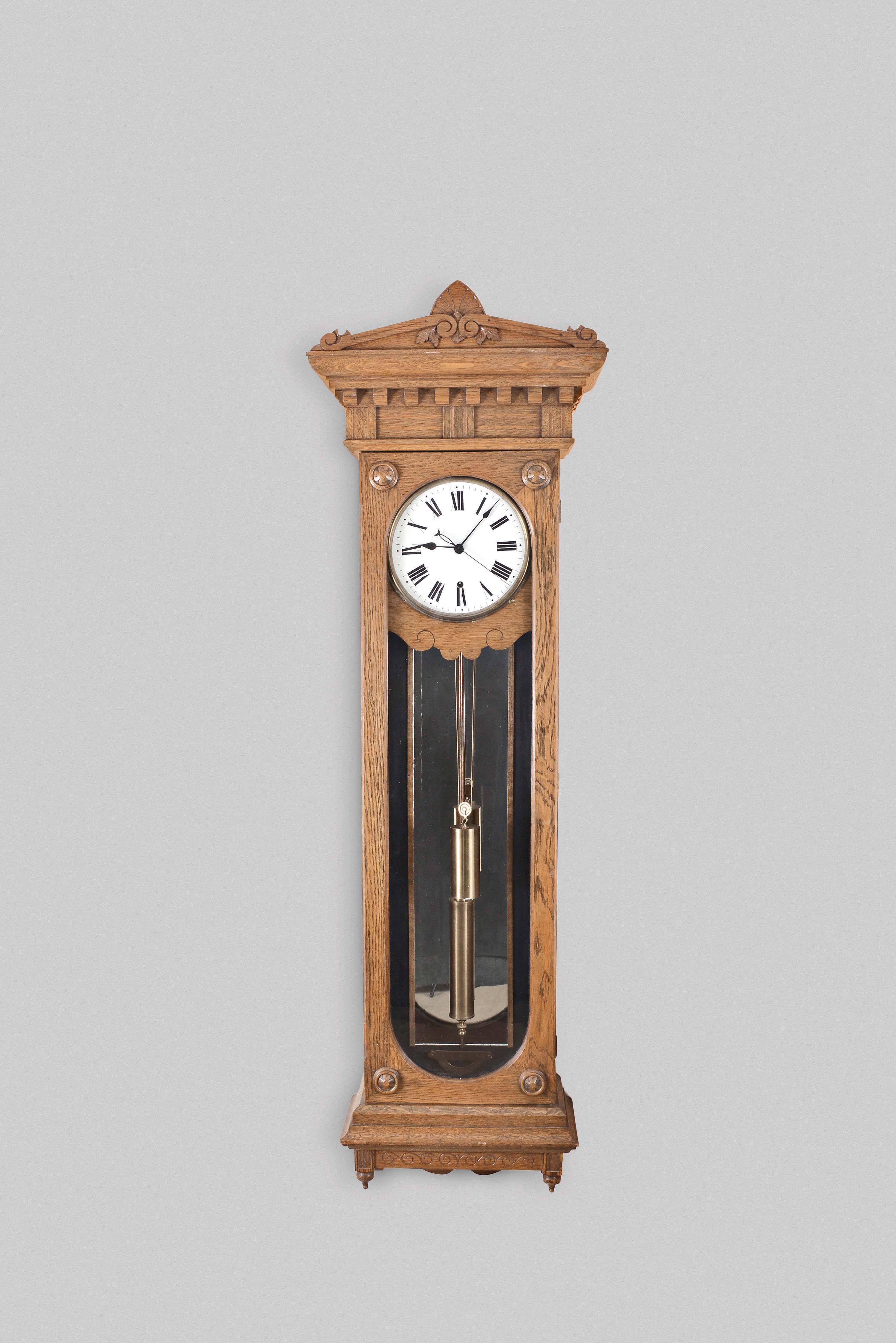 New Haven Clock Co., New Haven, Conn., "Regulator No. 10", hanging jeweler's regulator, 8 day, time only, weight driven movement with deadbeat escapement and maintaining power in an oak case with a white enamel dial — Antique Clocks Price Guide