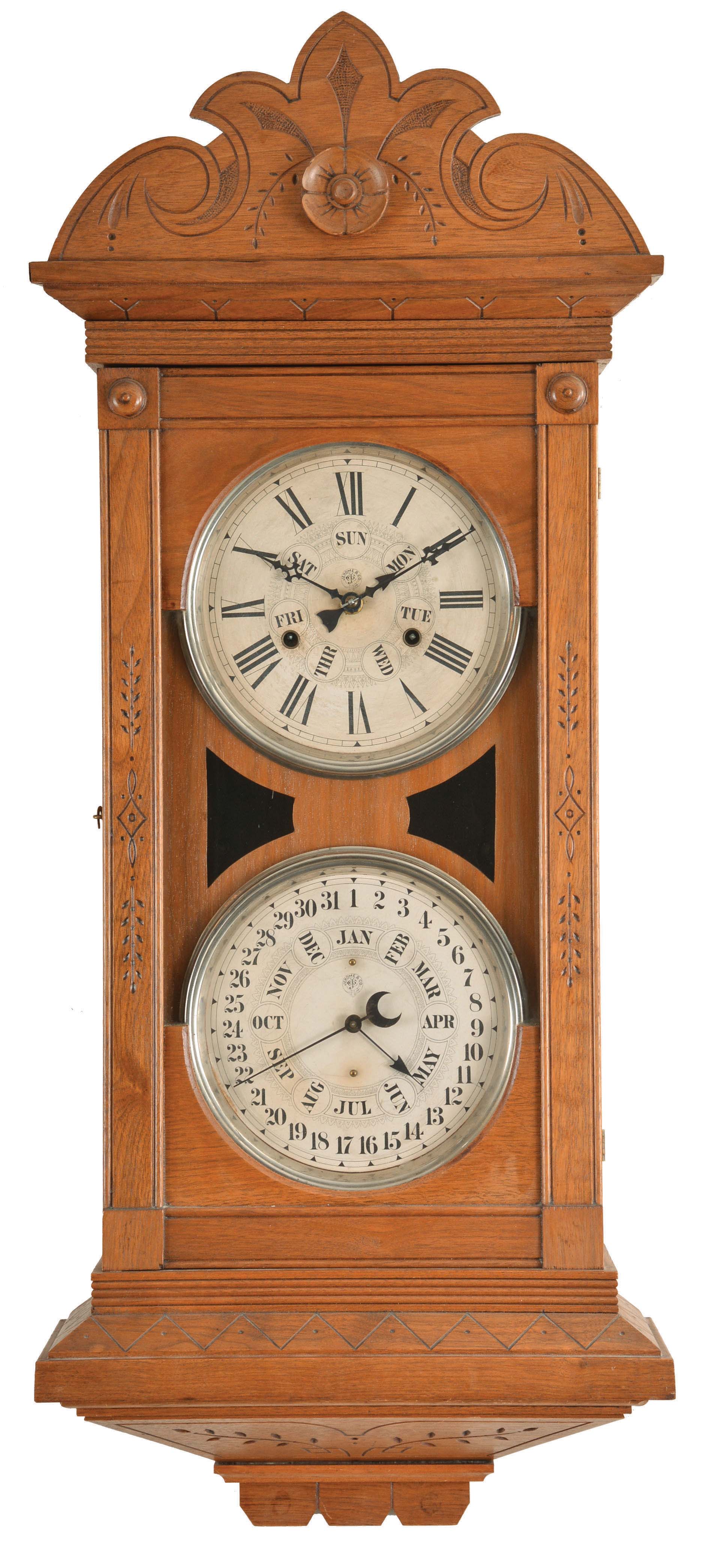 Jerome & Co. (New Haven Clock Co.), New Haven, Conn., "Dneister" wall hanging double dial calendar clock with a spring driven, 8 day, time and strike movement and a B. B. Lewis perpetual calendar mechansim in a walnut case. — Antique Clocks Price Guide