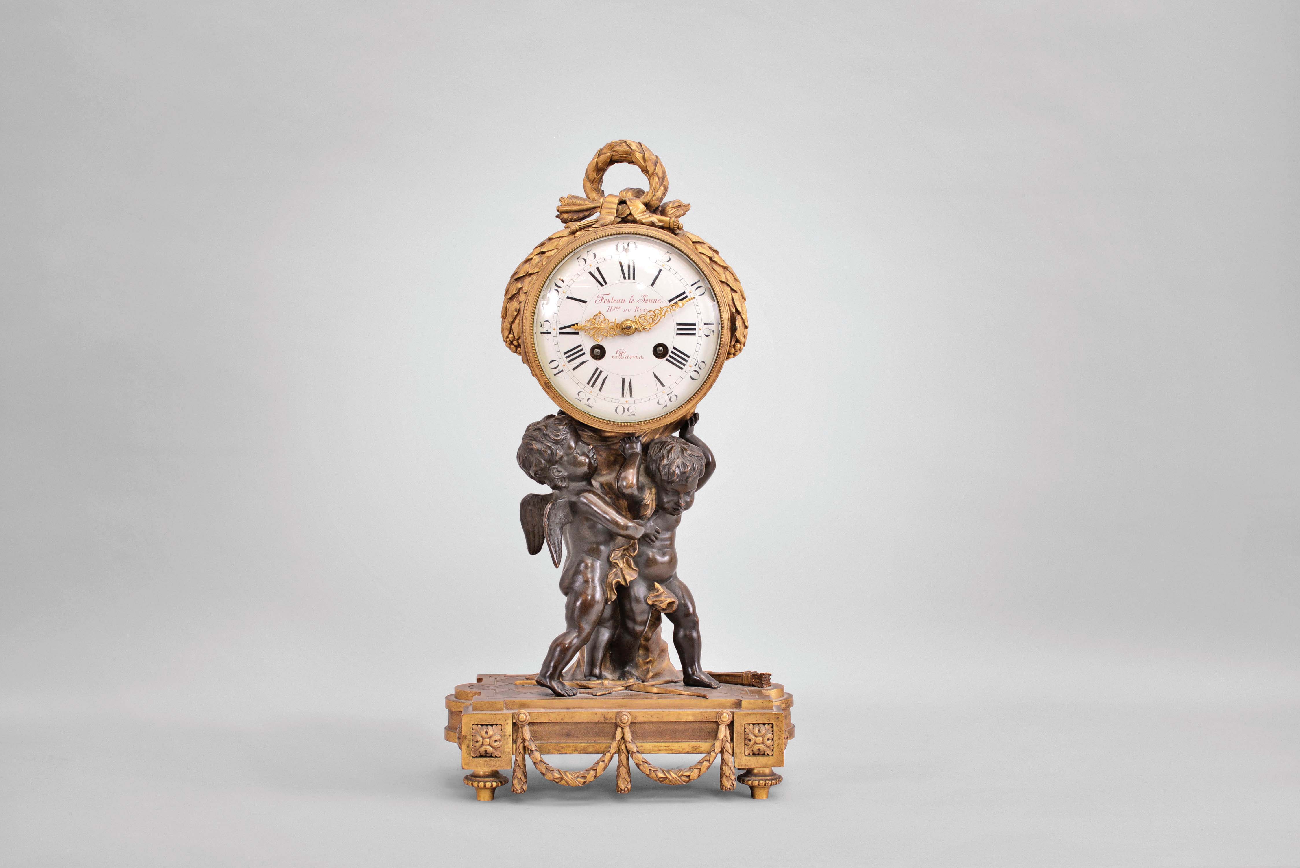 French, J.E.D., Paris, 8 day, time and strike, spring driven brass movement figural mantel clock with white enamel dial reading "Festeau le Jeune Hger du Roy / Paris". — Antique Clocks Price Guide