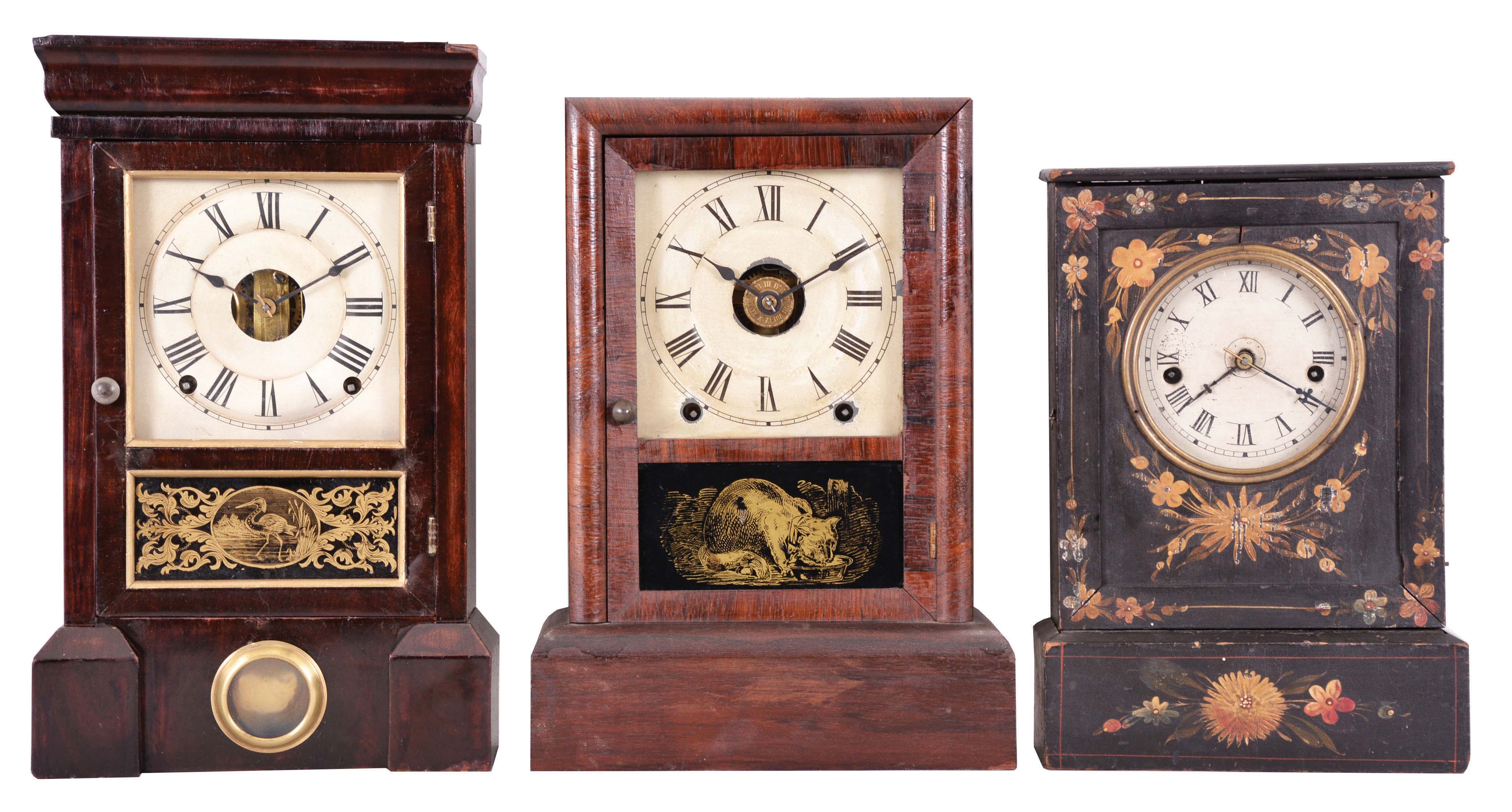 Clocks- 3 (Three): (1) Seth Thomas Clock Co., Plymouth Hollow, Conn., "O.G.Top" shelf clock with a spring driven, 8 day, time and strike lyre movement in a darkly stained rosewood veneer case.c1865. (2) Seth Thomas Clock Co., Thomaston, Conn., "Cottage Extra" shelf clock with a spring driven time, strike and alarm movement in a rosewood veneer case, c1879. (3) Chauncey Jerome, New Haven, Conn., "Union" model shelf clock with a spring driven, 30 hour, time and strike movement in a decorated wood case, c1850. — Antique Clocks Price Guide