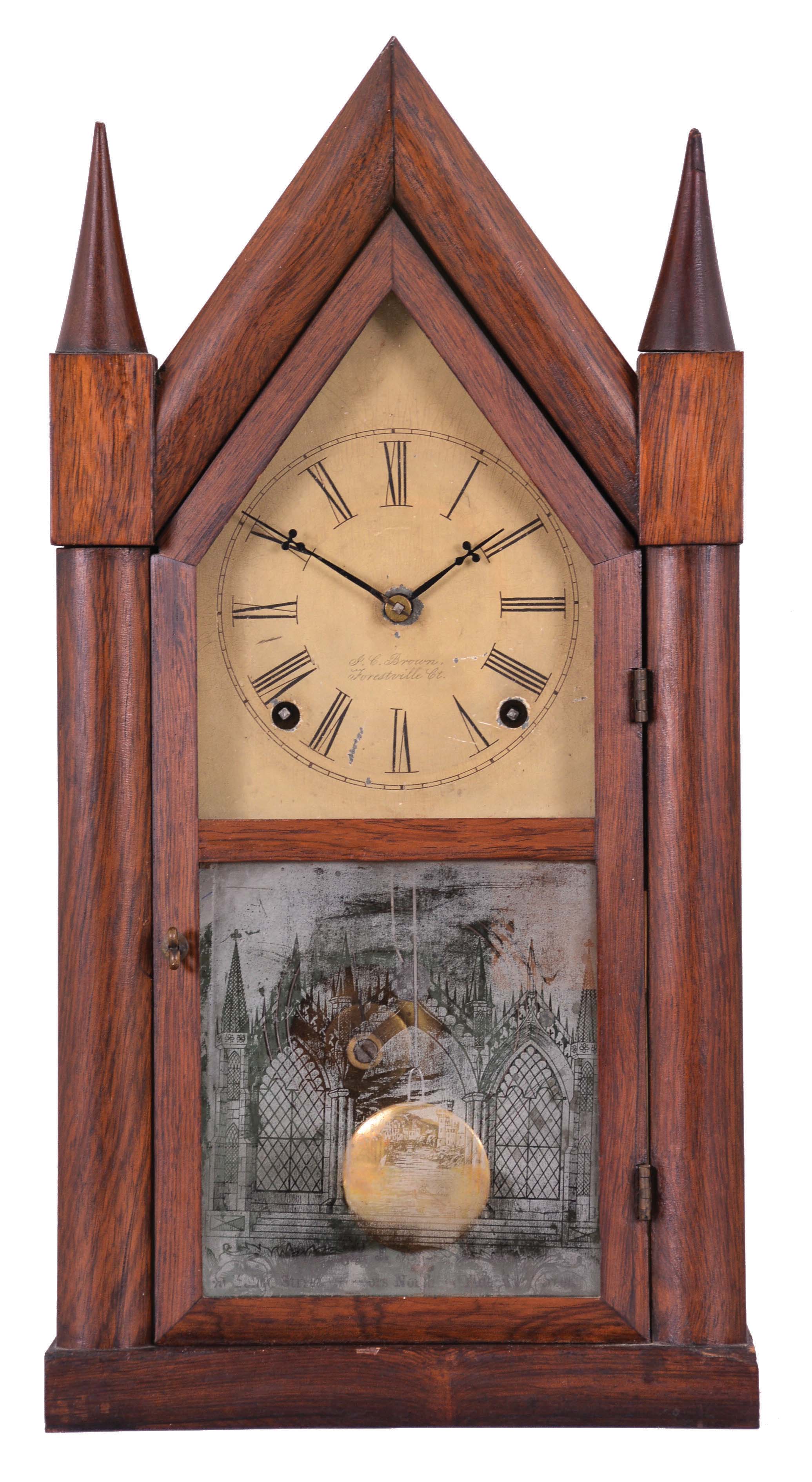 Forestville Mfg. Co., (J. C. Brown), Forestville, Conn., 8 day, time and strike, spring brass movement sharp gothic or steeple clock. This example has an overpasted label inside that reads: "Patent Spring Brass Clocks, sold by J. W. Miller, Toronto" — Antique Clocks Price Guide
