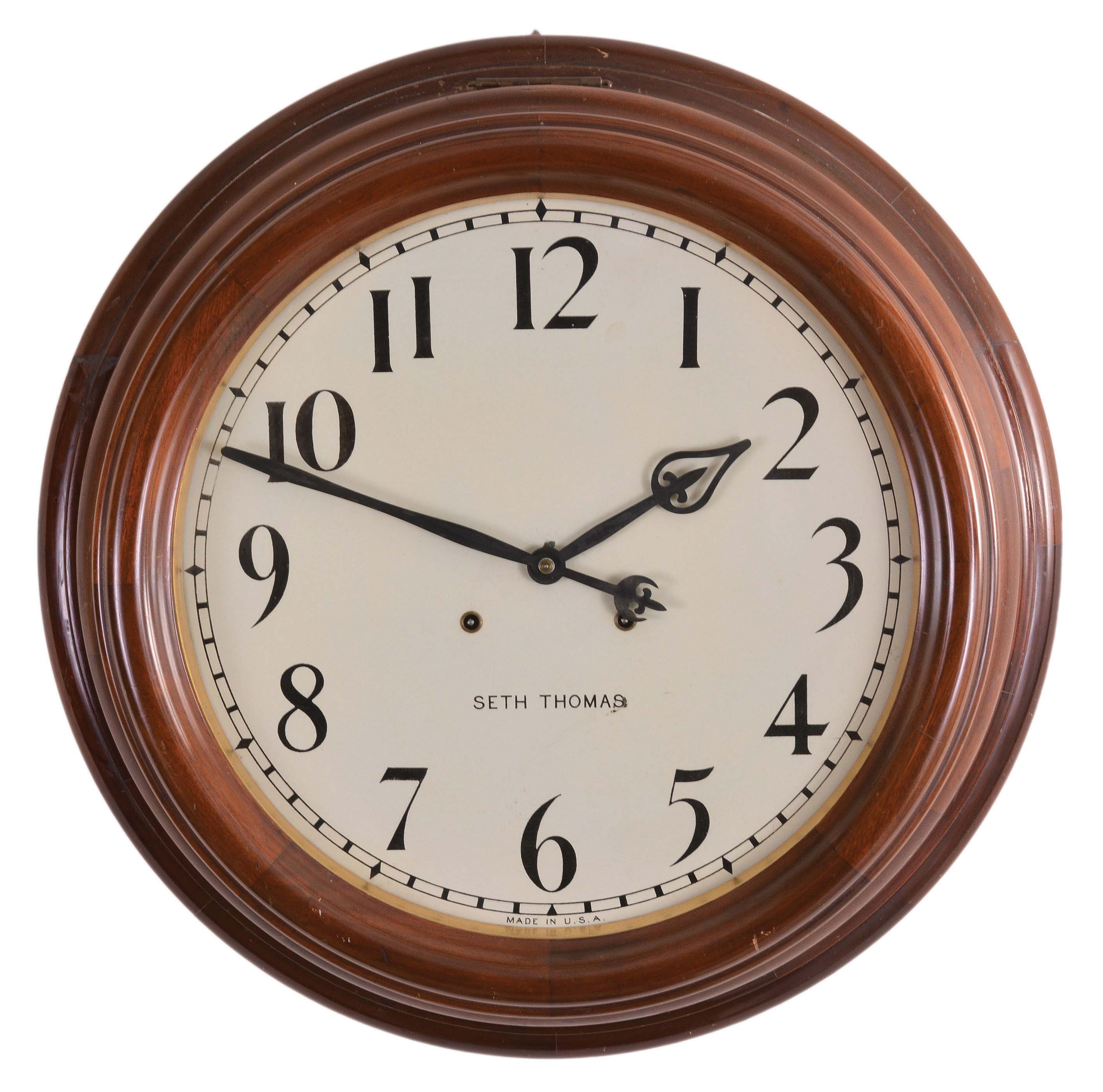 Seth Thomas Clock Co., Thomaston, Conn., "Gallery 18-Inch" hanging clock with a spring driven, 15 day, timepiece movement in a solid mahogany case. — Antique Clocks Price Guide