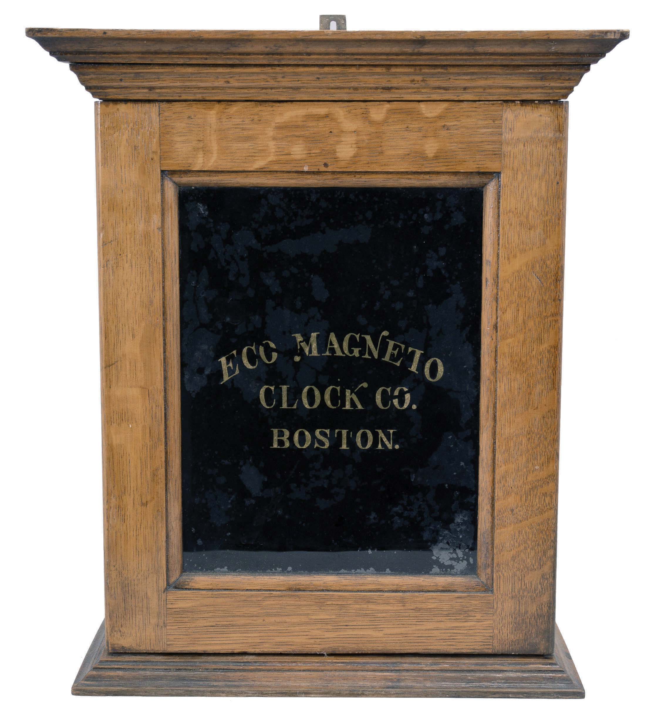 Eco Magneto Clock Co., Boston, Mass., circular dial time recorder, 8 day, time and recorder function for 4 watchman's stations, twin-spring Seth Thomas No. 10 balance wheel movement in an oak case with black glass and gold leaf reading "Eco Magneto Clock Co. / Boston". — Antique Clocks Price Guide