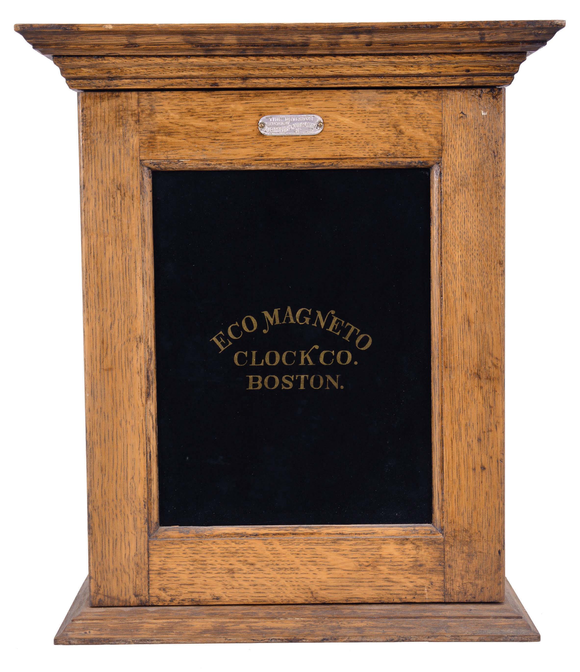 Eco Magneto Clock Co., Boston, Mass., circular dial time recorder, 8 day, time and recorder function for 9 watchman's stations, twin-spring Seth Thomas balance wheel movement in an oak case with black glass and gold leaf reading "Eco Magneto Clock Co. / Boston", metal tag above the glass reads "Time Recorder / Inspected by Underwriters' Laboratories / No. 11020". — Antique Clocks Price Guide