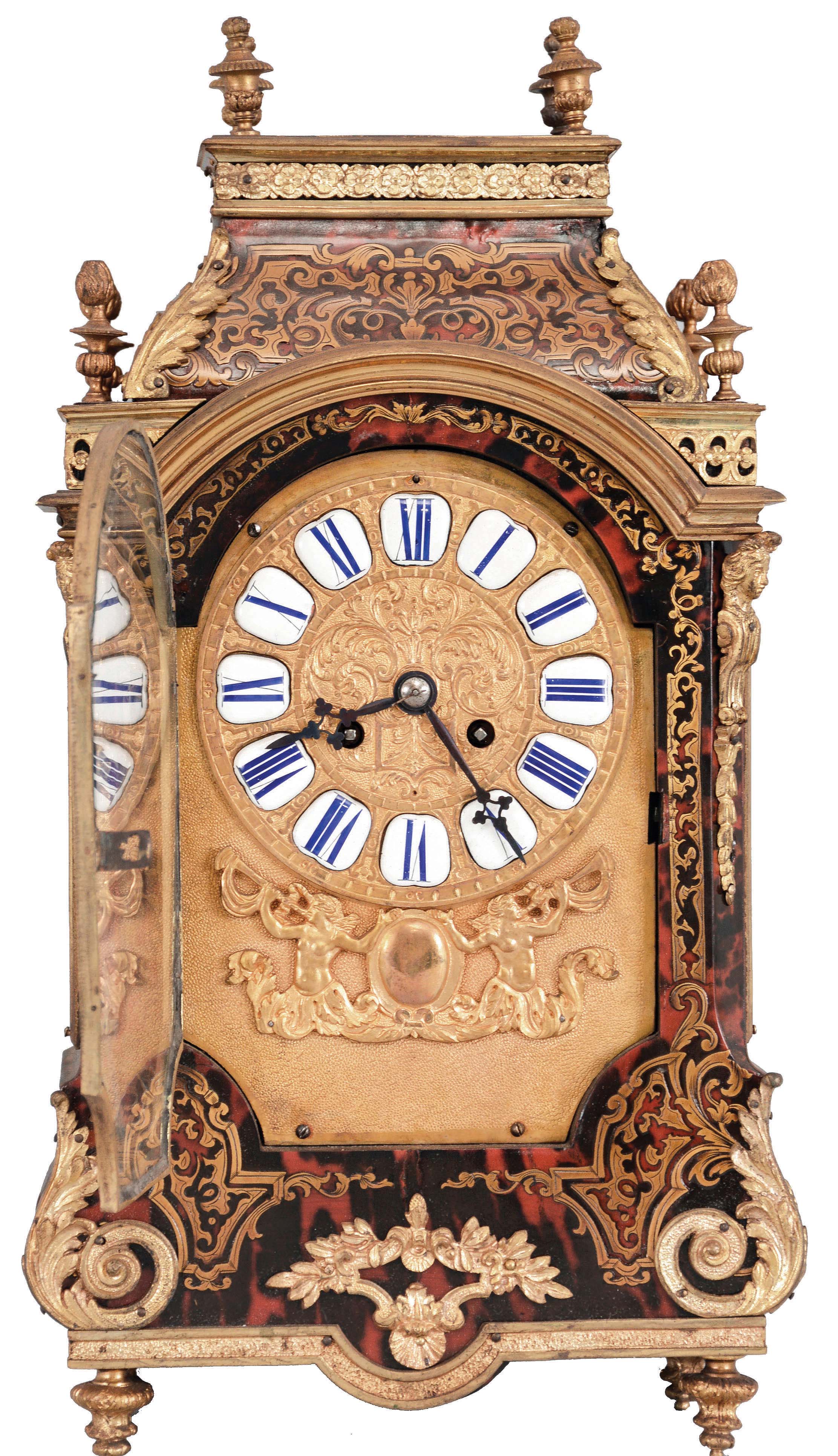 France, a late 19th century Boulle work, pendule religieuse style clock with matching bracket, the brass inlaid case on gilt feet, the base with applied foliate ornament, half caryatid corners, and gilt cornice molding, the incurved top also with acanthus mounts, and eight urn finials, shaped door, before a gilt dial plate, mounted with roman numeral, white enamel cartouches, above addorsed horn blowers and central cartouche, blued steel hands, 8 day, two train pendule de Paris movement marked "MF&F", the clock resting on a cyma reversa shaped, brass inlaid, bronze mounted bracket, matching the case — Antique Clocks Price Guide