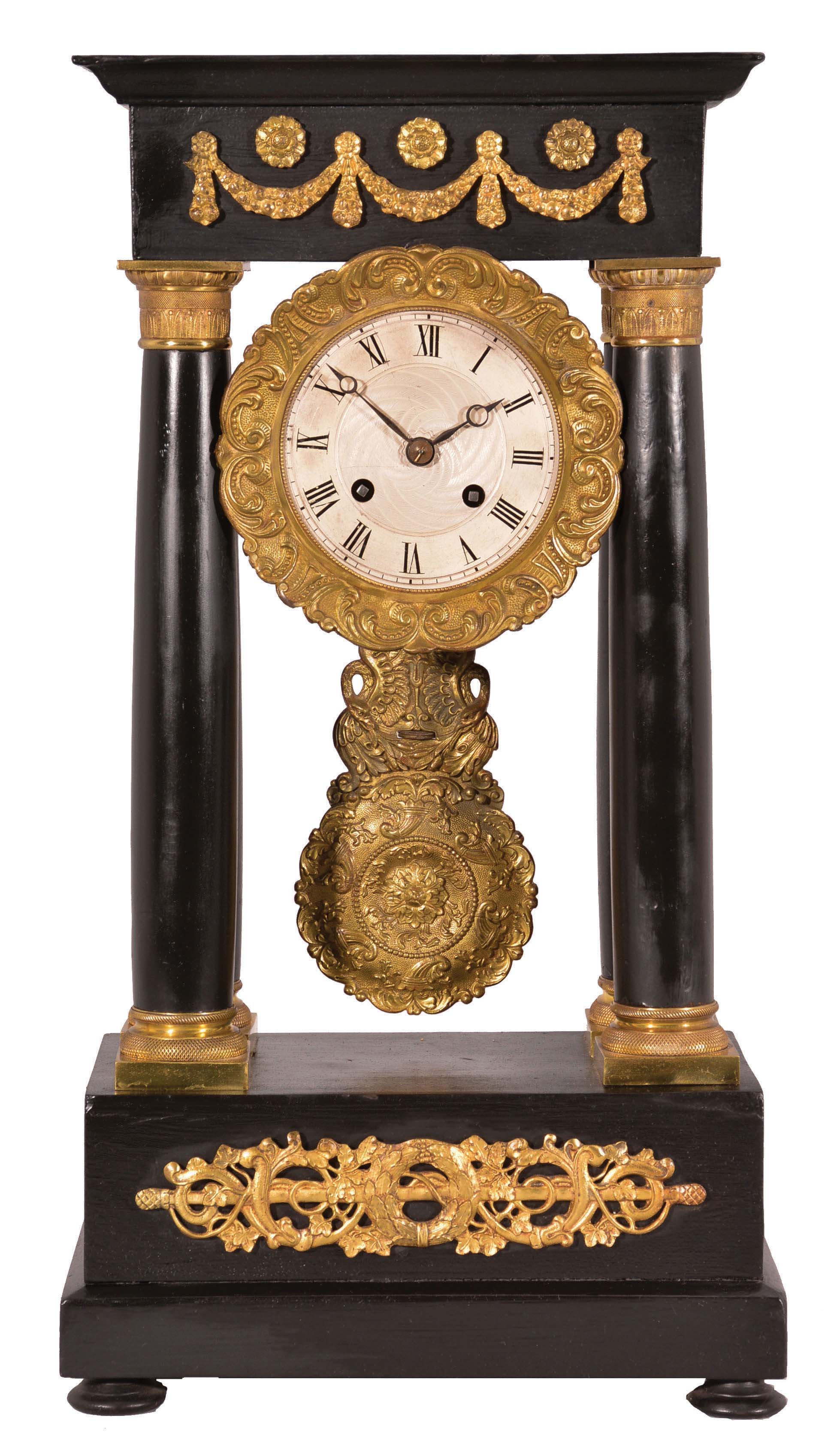 Vincenti & Cie, Paris, France, French empire four-column portico clock, 8 day, time and bell strike, spring-driven pendule de Paris movement in an ebonized wood case with elaborate gilt bronze ornaments, bezel, and pendulum, 3.5 inch silvered guilloche dial with Roman numerals, Breguet style blued steel hands. — Antique Clocks Price Guide