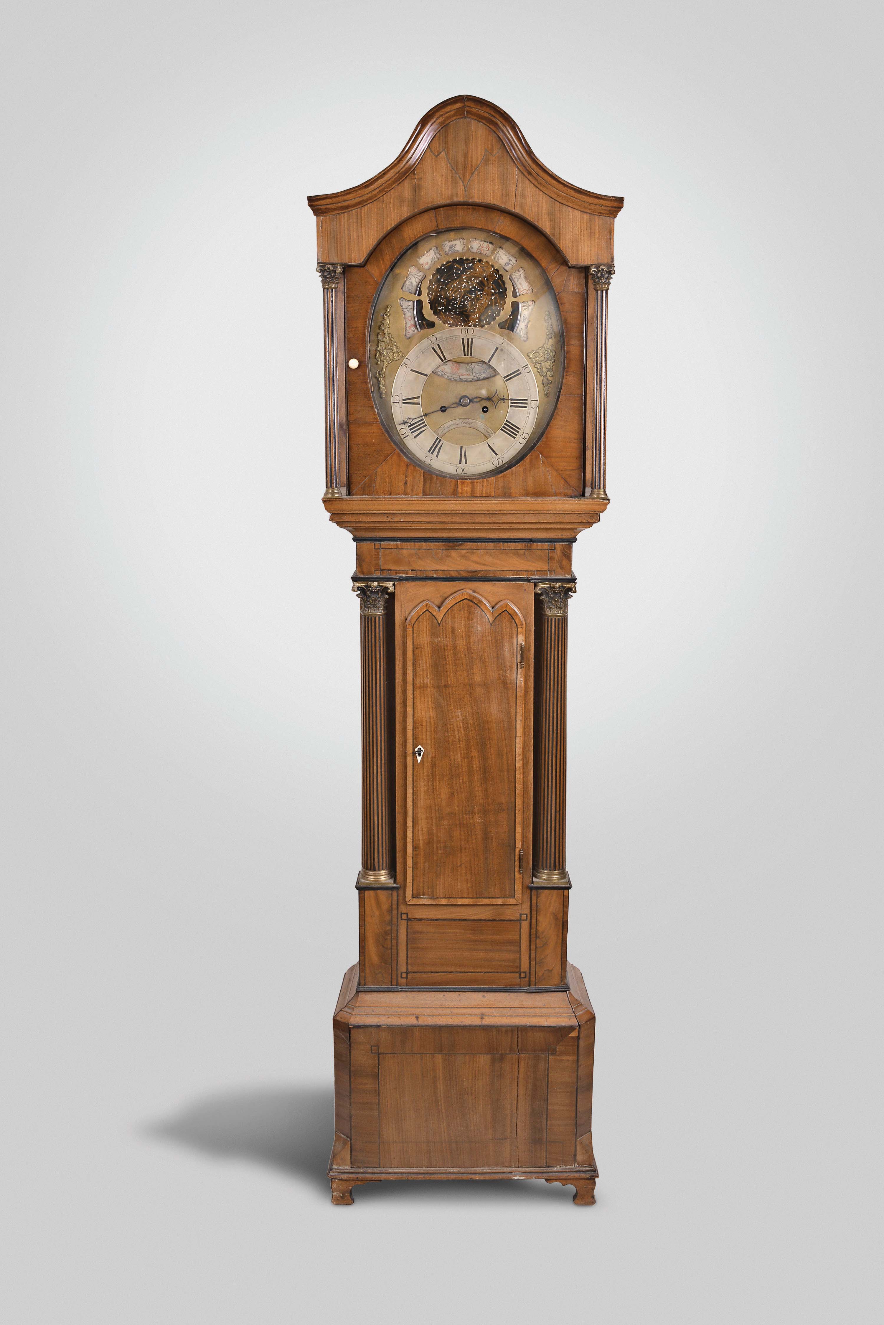 Thomas Moore, Ipswich, England, tall clock, 8 day, time and strike, weight driven movement with celestial display and signs of the Zodiac on the brass dial with silvered chapter ring, signed by the maker and in a mahogany veneer case with ebonized inlay with pagoda type top and full Corinthian columns surmounted by brass capitals on both hood and trunk — Antique Clocks Price Guide