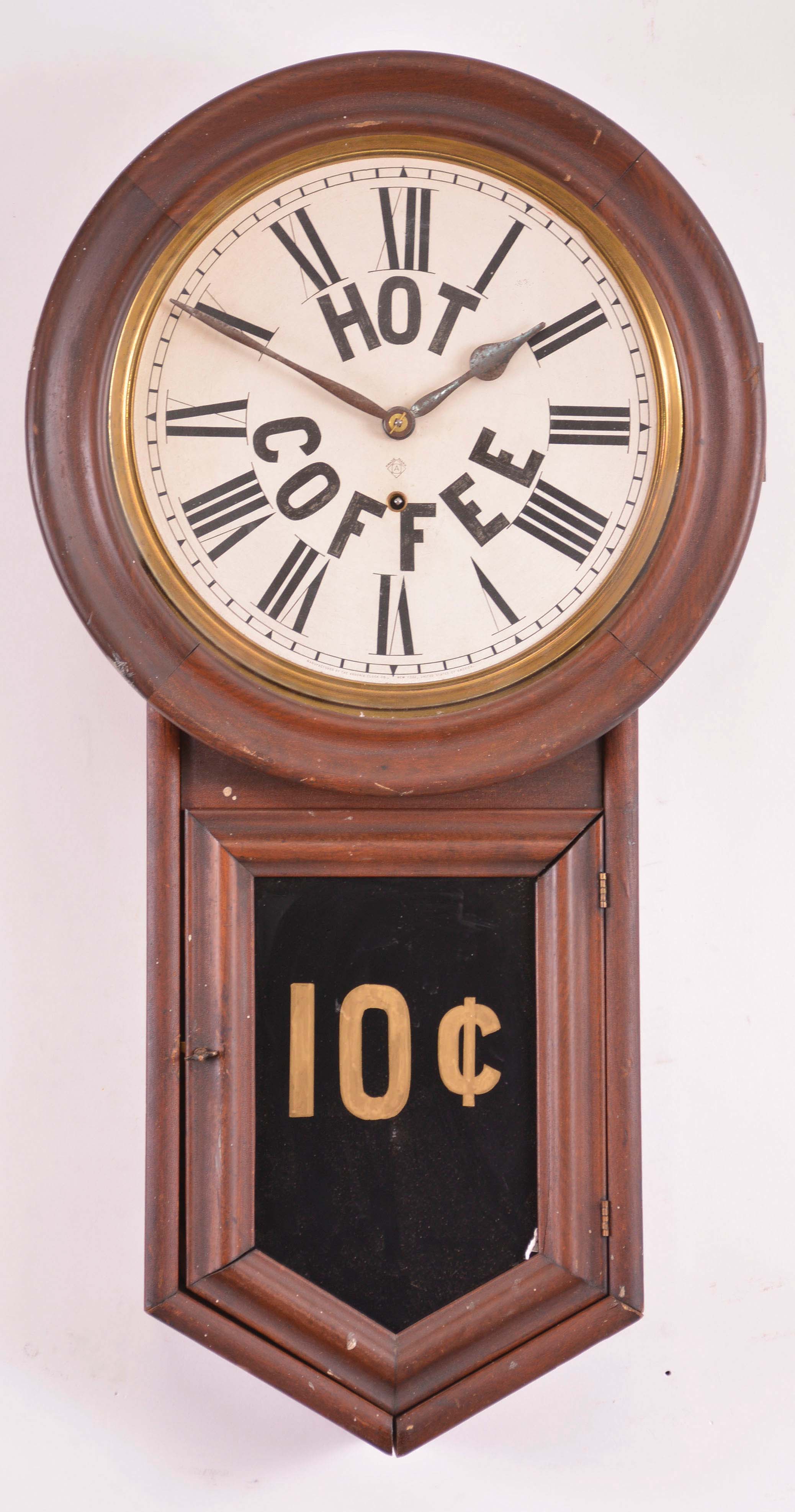 Clocks- 2 (Two) Advertising wall clocks, 8 day, time only, spring driven : (1) New Haven Clock Co., Lucky Strike advertising clock with tablet reading "Bragg, Cummings and Co. Bangor, ME.", c1900. (2) Ansonia Clock Co., New York, advertising clock in dark wood case with dial reading "HOT COFFEE", c1900. — Antique Clocks Price Guide