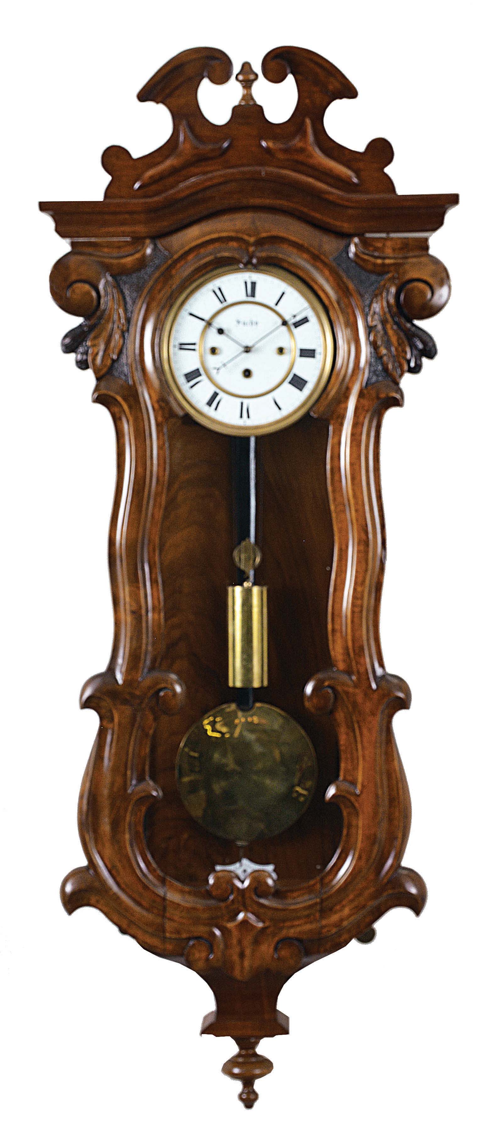 Clocks- 2 (Two) Vienna regulators: (1) C. Suchy & Sohne, Vienna, Austria, 30 hour, time and grande sonnerie strike on two gongs, movement driven by two springs and one weight in a serpentine wood case with some walnut veneer, enamel dial signed "Suchy", c1865. (2) Gustav Becker, Freiberg, Germany, 8 day, time and strike, weight driven movement in a walnut and walnut veneer altdeutsch style case, c1875. — Antique Clocks Price Guide