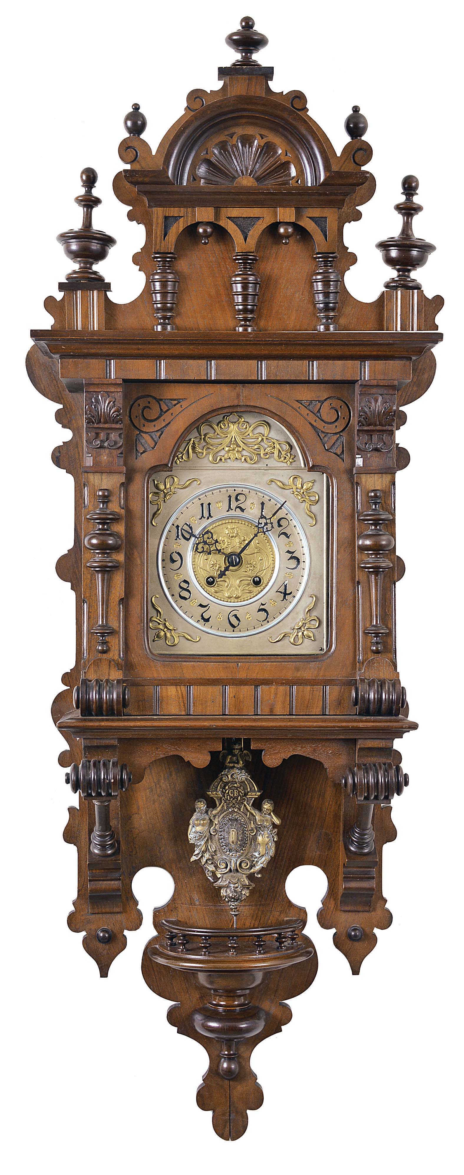 Clocks- 2 (Two) Becker Freischwingers: (1) Gustav Becker, Freiberg, Germany, free swinger wall clock, 8 day, time and gong strike, spring driven movement in an oak Altdeutsch style case with silvered dial, c1904. (2) Gustav Becker, Freiberg, Germany, 8 day, time and strike, spring driven movement in a walnut veneered Altdeutsch style case with silvered dial and fancy cast brass pendulum, c1896. — Antique Clocks Price Guide