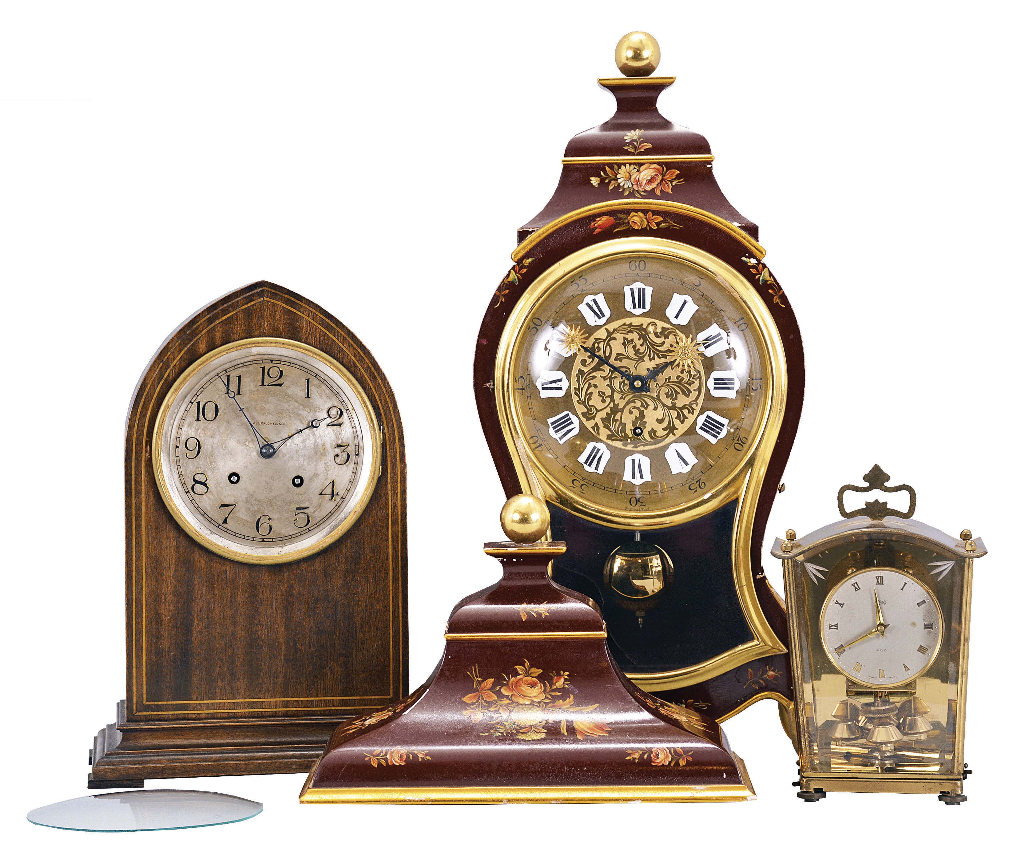 Clocks- 3 (Three) Mantel: (1) Zenith, Le Locle, Switzerland, reproduction Neuchatel bracket clock, 8 day, time and strike, tandem spring driven movement in a floral decorated painted wood case. (2) Waltham Clock Co., Waltham, Mass., lancet mantel clock, 8 day, time and strike, spring driven balance wheel movement in a walnut case with silvered dial reading "J.E. Caldwell & Co.". (3) Shatz, Germany, 400 day or anniversary clock, time only, spring driven movement with torsion pendulum in a brass and glass case. — Antique Clocks Price Guide