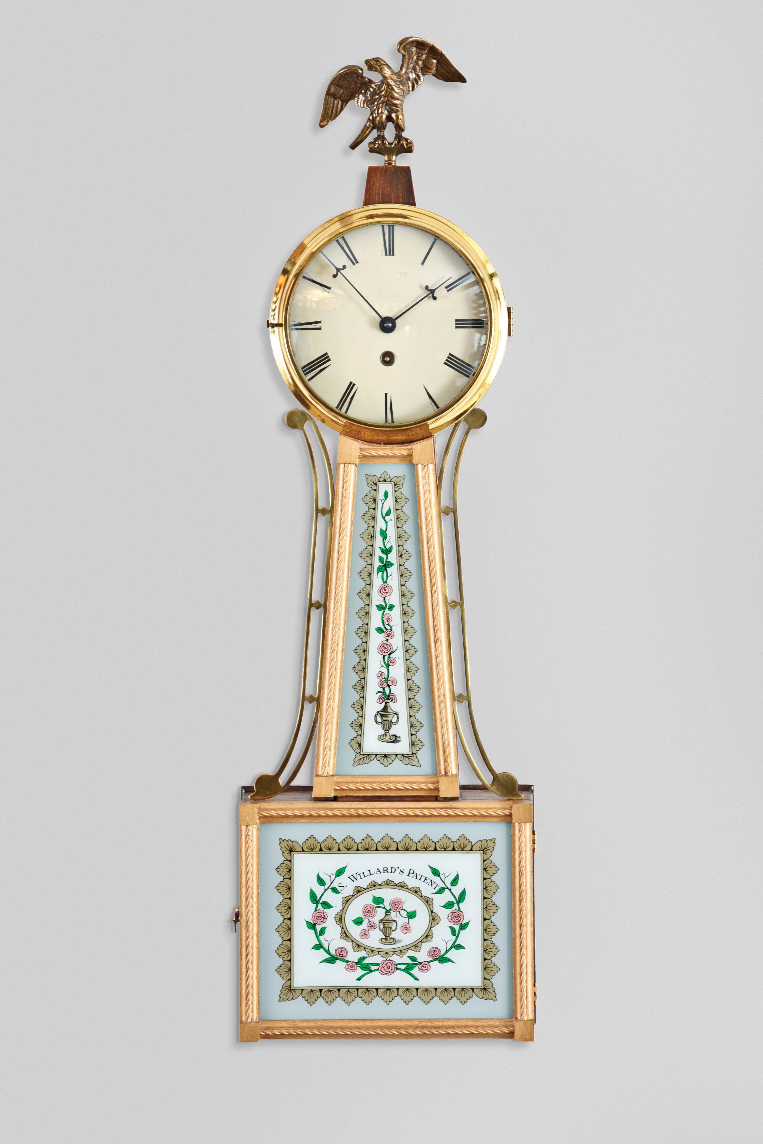 Gebrueder Jauch, Schwenningen, Germany, reproduction Willard banjo clock, 30 hour, time only, spring driven movement in a walnut case with reverse painted tablets, the lower one reading "S. Willard's Patent". — Antique Clocks Price Guide