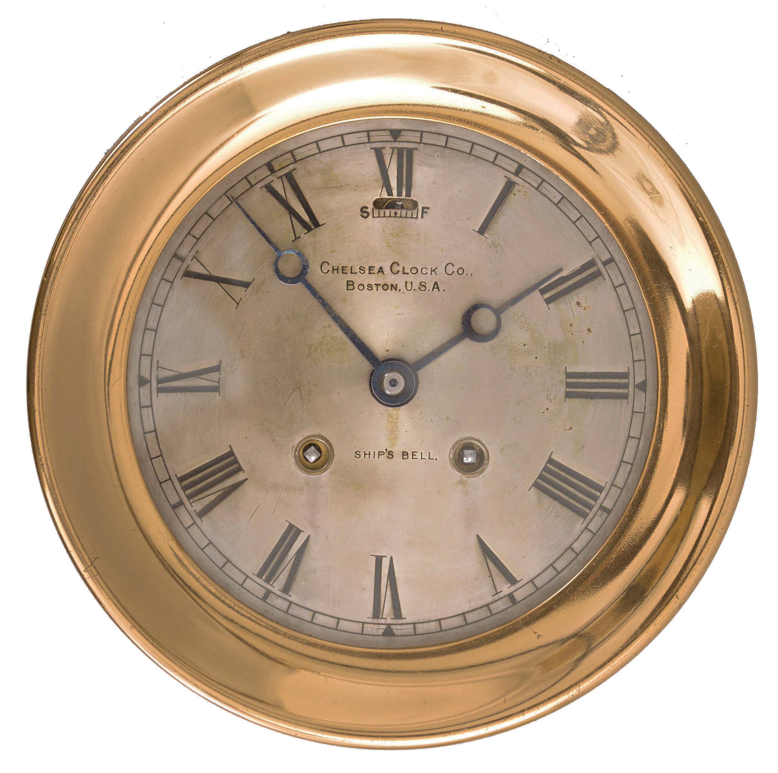 Chelsea Clock Co., Boston, Mass., marine clock, 8 day, time and ship's strike, spring driven jeweled balance wheel movement in a brass case with screw-on bezel and 5.5 inch silvered dial with blued steel Breguet style hands. — Antique Clocks Price Guide