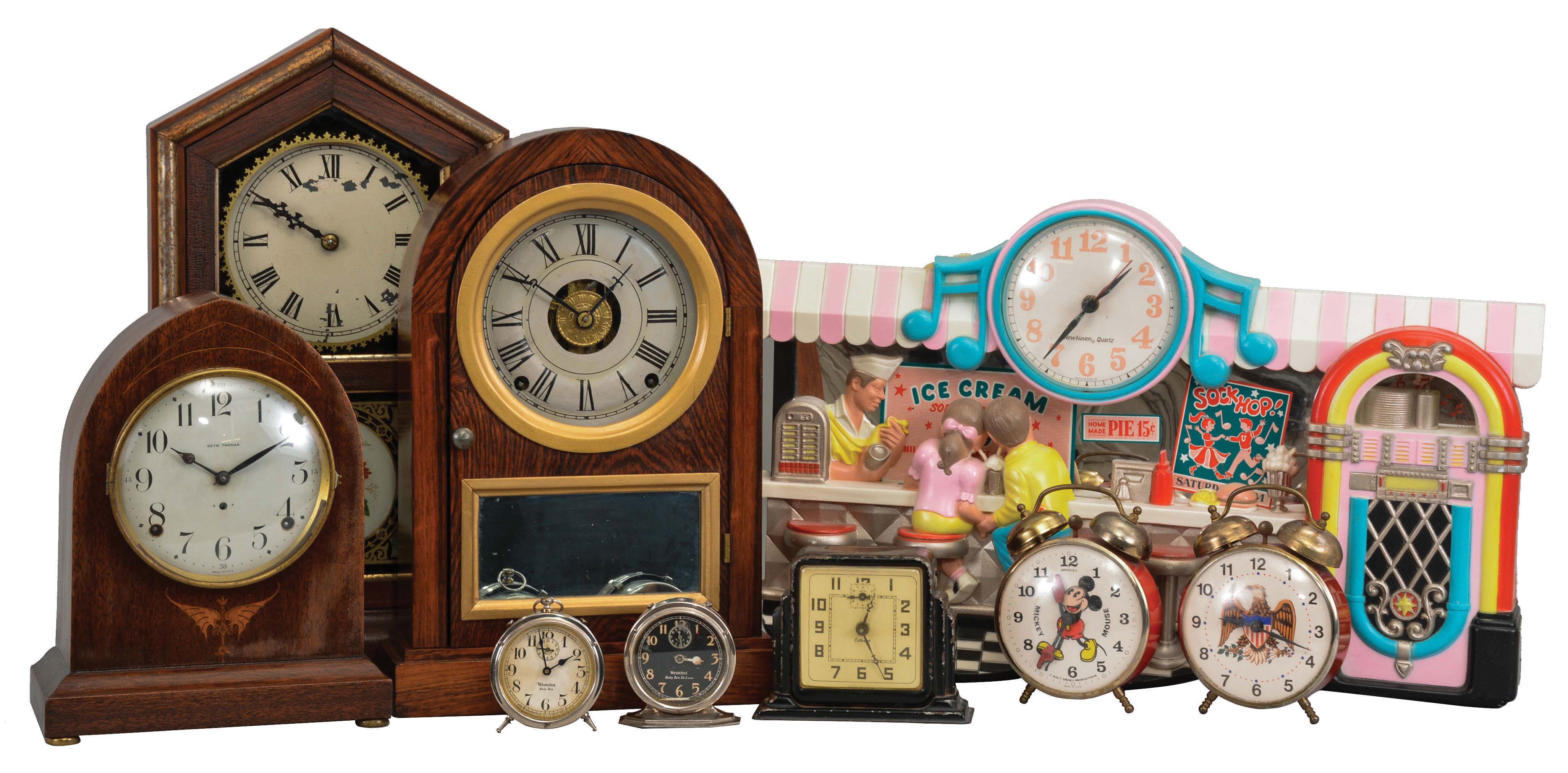 Clocks- 9 (Nine): (1) Seth Thomas Clock Co., Thomaston, Conn., "Prospect No. 17" shelf clock with a spring driven, 8 day, time and half hour strike movement in a mahogany veneered case, c1917. (2) New Haven Clock Co., New Haven, Conn., "Tuscan" shelf clock with a spring driven, 8 day, time and strike movement in a rosewood veneered case, c1880. (3) Seth Thomas Clock Co., Thomaston, Conn., unidentified model shelf clock with a spring driven, 8 day, time, strike and alarm movement in a rosewood veneered case, c1870. (4) New Haven Clock Co., New Haven, Conn Diner novelty clock with a battery operated quartz movement in a plastic case., c1955 (5) Gilbert Clock Co., Winsted, Conn., "Aussie's" alarm clock with a 30 hour, time and alarm movement in a metal case, c1930. (6) Lux/Robert Shaw alarm clock, c1950. (7) Mickey Mouse alarm clock c1960. (8) Western Clock Co., LaSalle, Illinois, "Baby Ben" alarm clock in a nickel plated case, c1922. (9) Western Clock Co., LaSalle, Illinois, "Baby Ben Deluxe" alarm clock in a nickel plated case — Antique Clocks Price Guide
