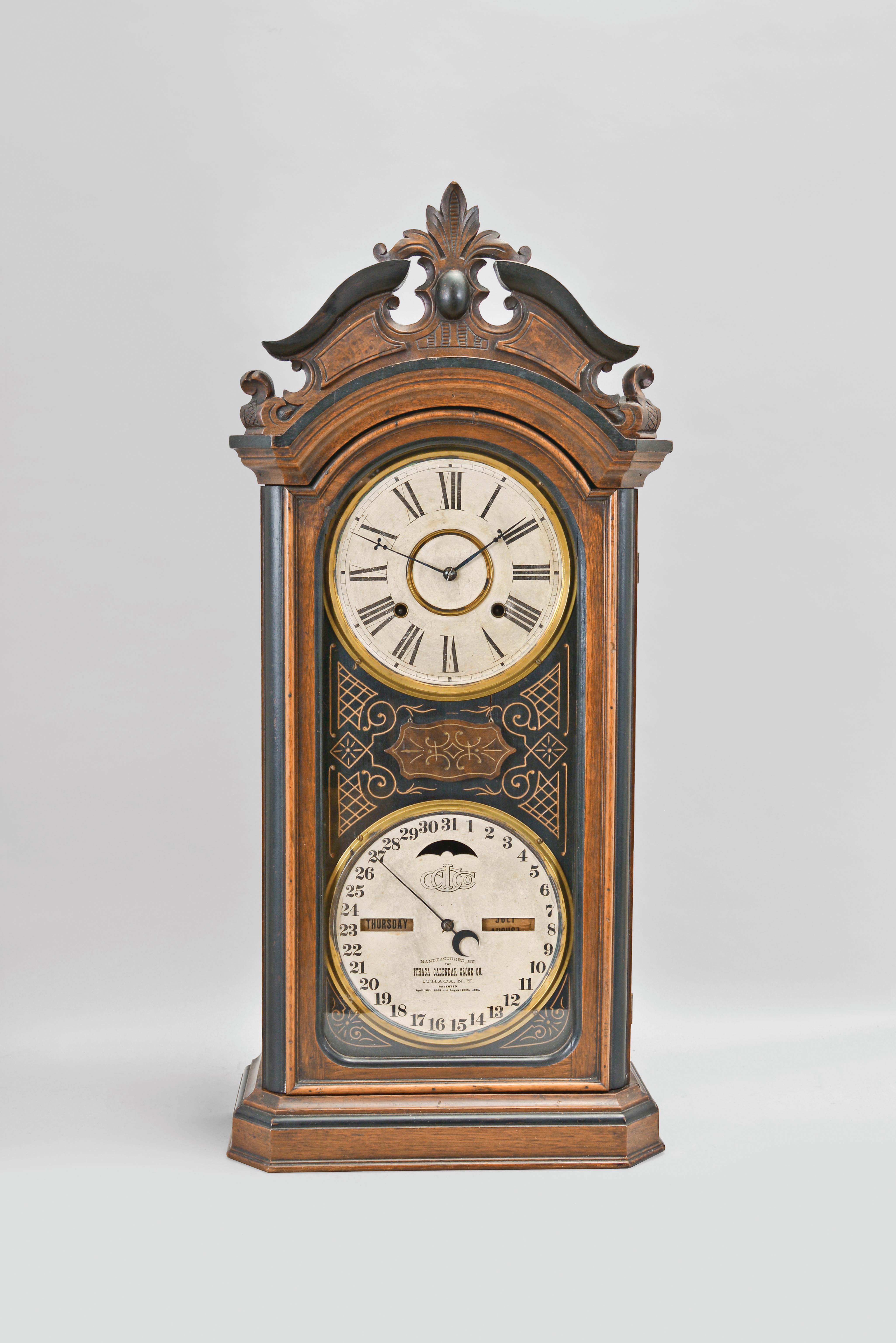 Ithaca Calendar Clock Co., Ithaca, New York, "Favorite No. 4 1/2" shelf clock with 8 day, spring driven E. N. Welch time and strike movement and a H. B. Horton patented perpetual calendar clock mechanism in a walnut case. — Antique Clocks Price Guide