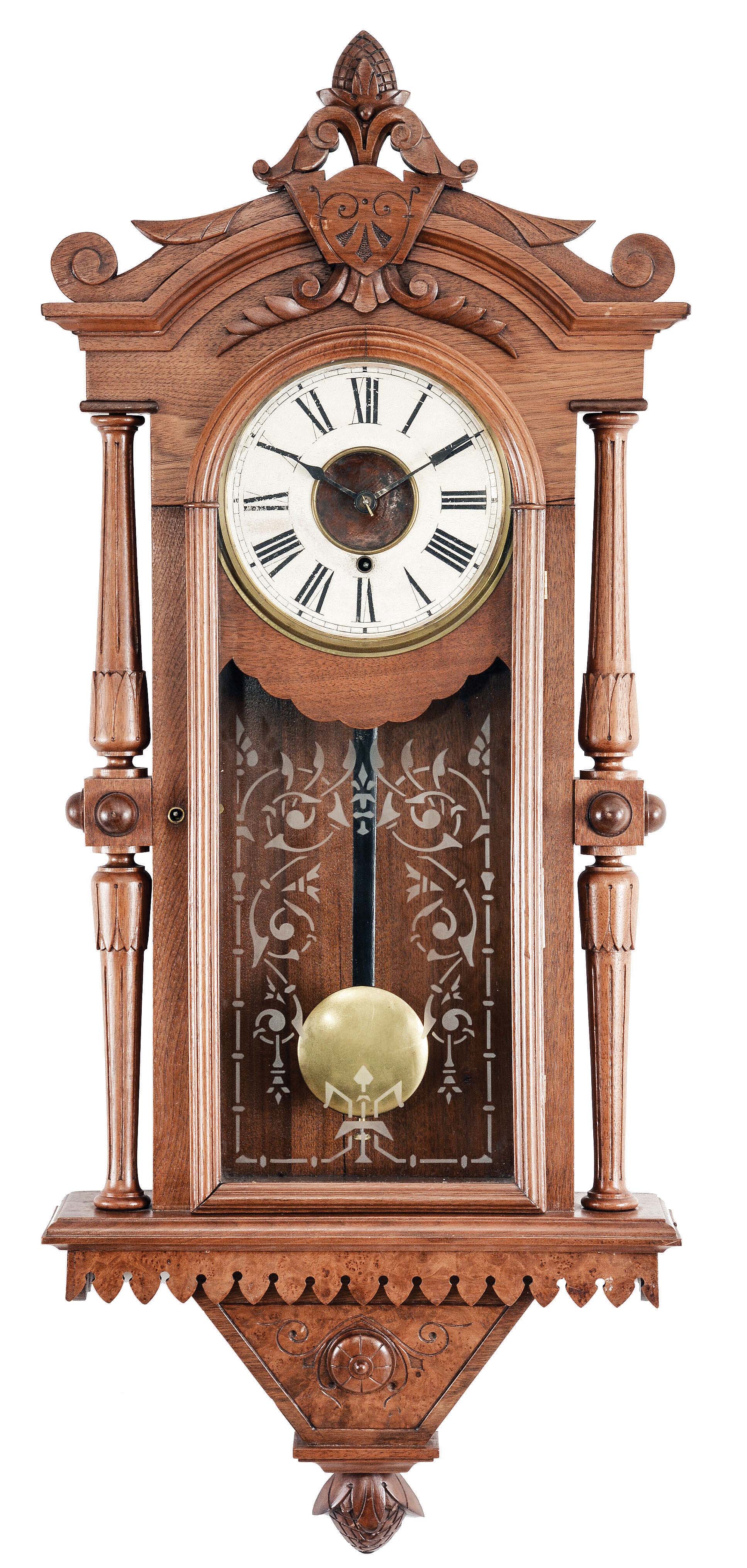F. Kroeber Clock Co., New York, "Regulator No. 30" wall hanging clock with an E. N. Welch spring driven, 8 day, timepiece movement in a walnut case with burl accents. — Antique Clocks Price Guide