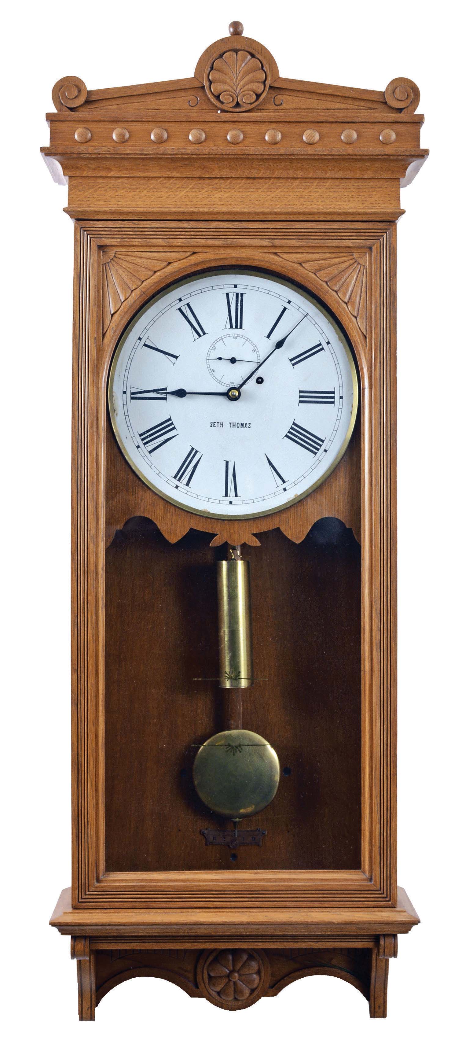 Seth Thomas Clock Co., Thomaston, Conn., "Regulator No. 30", wall clock, 8 day, time only, brass weight driven movement in an oak case with a painted metal dial and brass damascened pendulum — Antique Clocks Price Guide