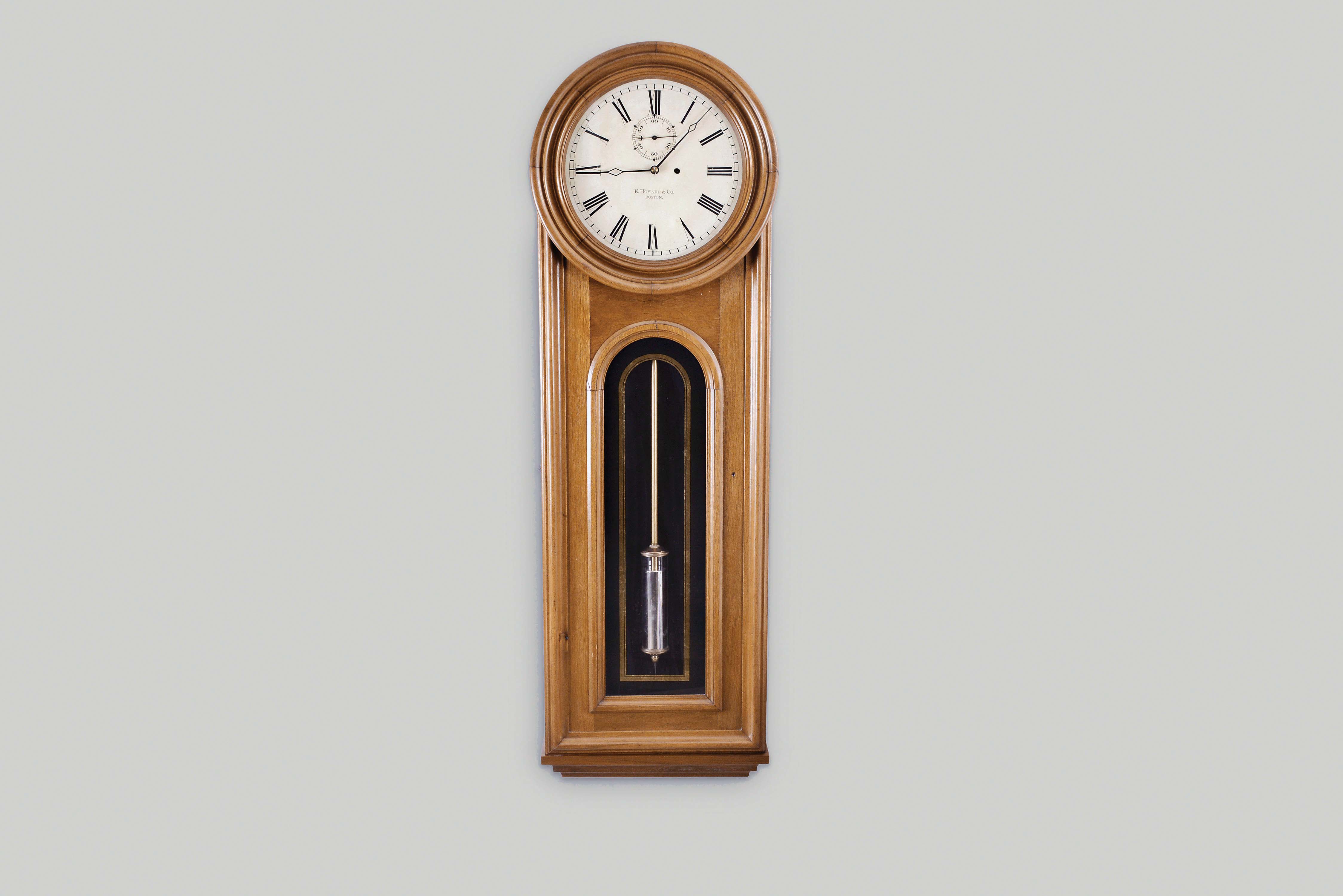 E. Howard & Co., Boston, Mass., "No. 12 Regulator", wall clock, 8 day, time only, weight driven movement in a walnut case with a painted metal dial and reverse painted tablet — Antique Clocks Price Guide