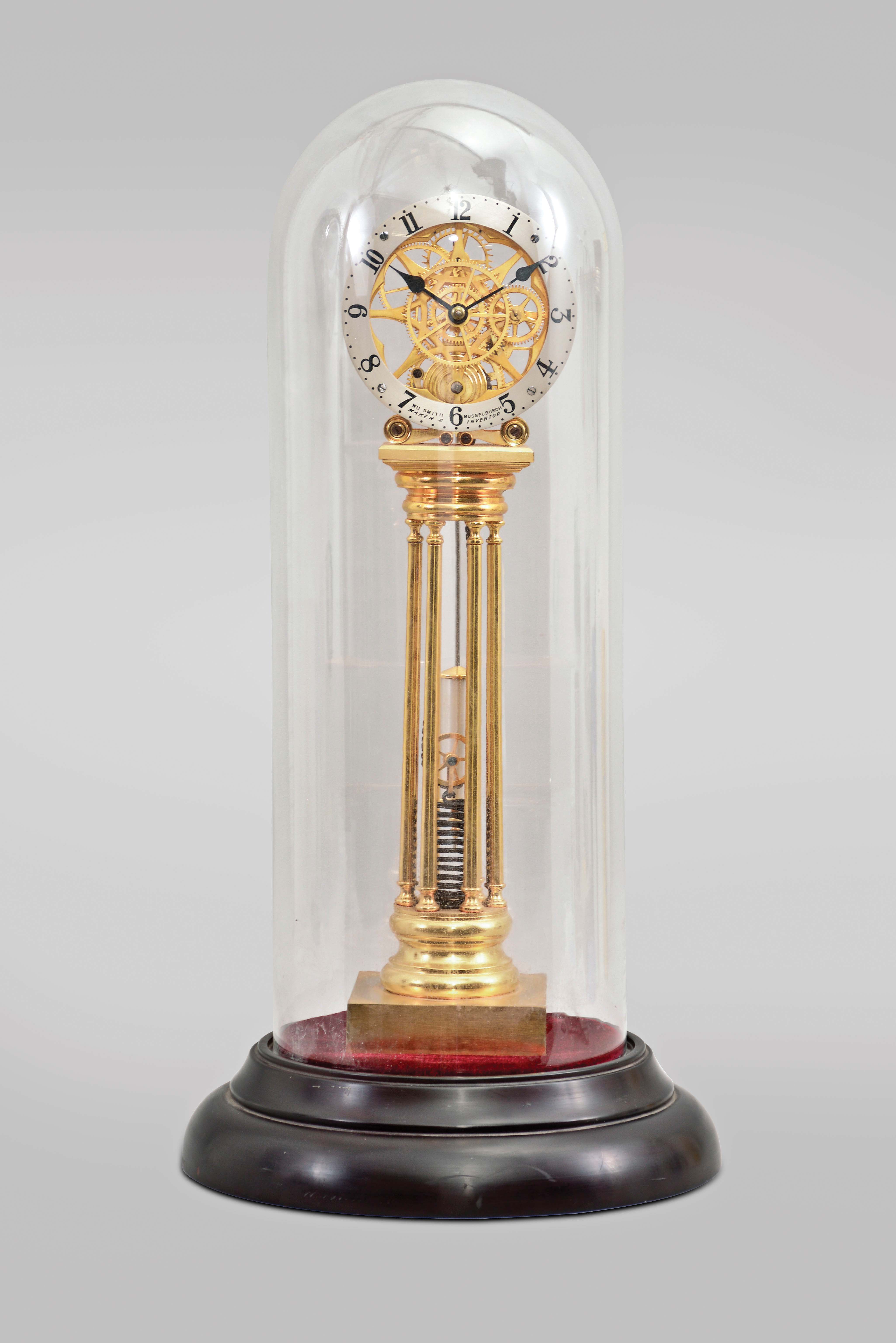 Asian, modern reproduction fusee skeleton clock under glass dome, 8 day, time only exposed movement powered by an extended coiled spring, silvered chapter ring reading "WU Smith, Musselburgh / Maker & Inventor", mounted on a velvet-covered black molded base, late 20th century. — Antique Clocks Price Guide
