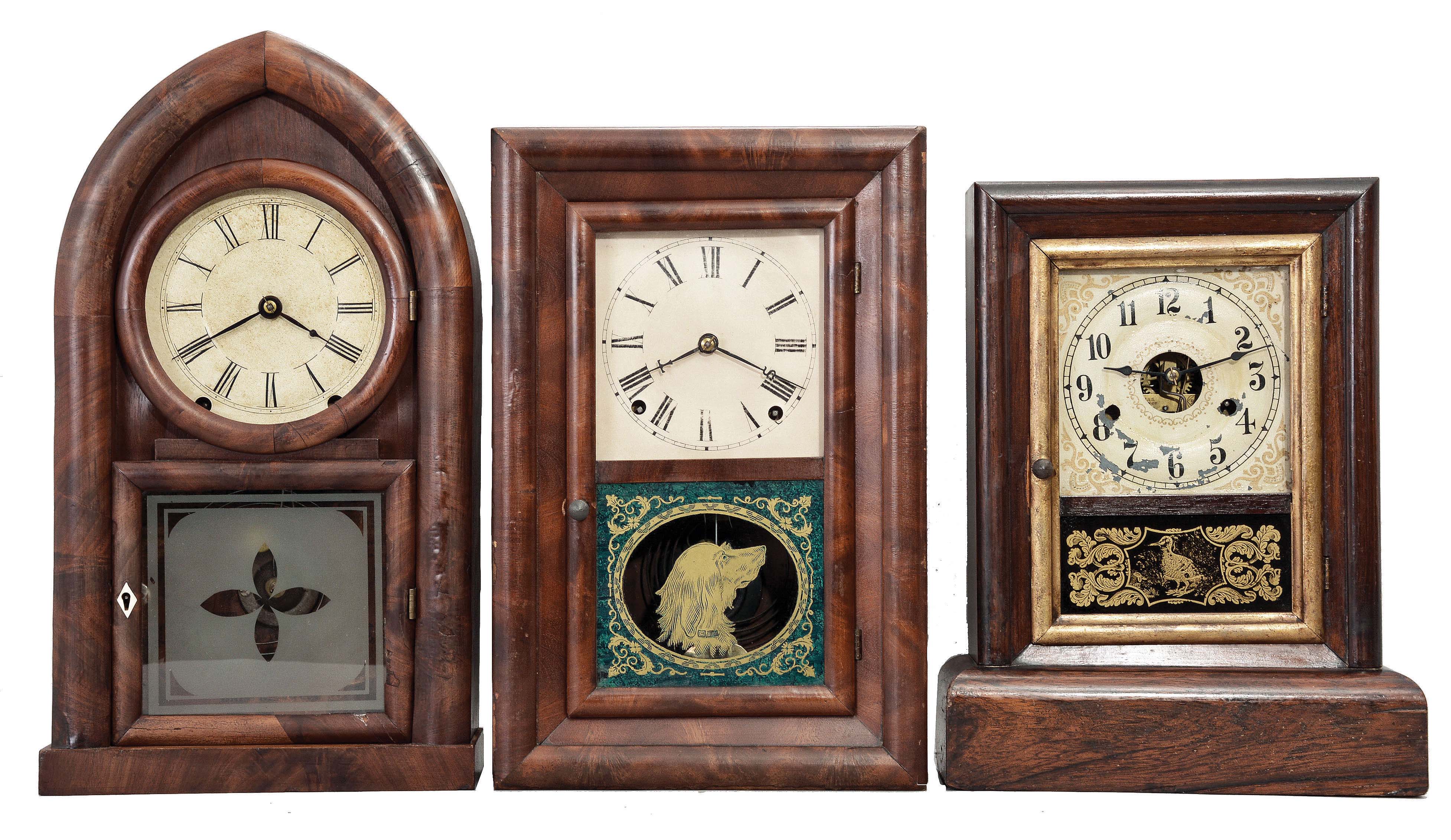 Clocks- 3 (Three): (1) Brewster and Ingrahams, Bristol, Conn., Round Gothic shelf clock with a spring (brass) driven, 8 day, time and strike movement in a mahogany veneered case, c1848. (2) Seth Thomas Clock Co., Thomaston, Conn., "Round Band" shelf clock with a spring driven, 8 day, time and strike movement in a mahogany veneered case, c1885. 3) Seth Thomas Clock Co., Thomaston, Conn., Cottage shelf clock with a spring driven, 30 hour, time and strike movement in a rosewood veneered case, c1885. — Antique Clocks Price Guide