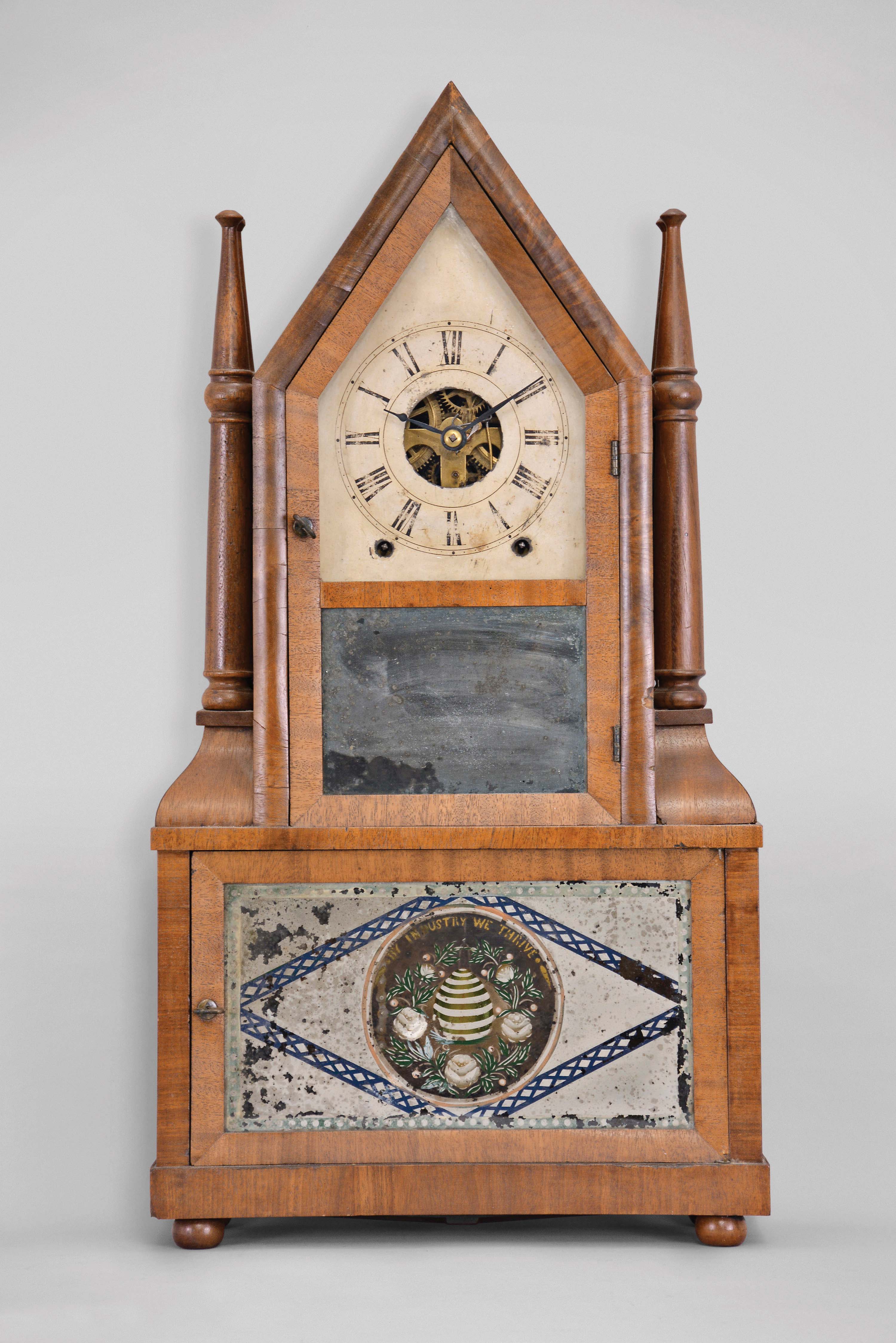Birge & Fuller, Bristol, Conn., 8 day, time and strike wagon spring driven brass movement steeple on frame with candle finials. — Antique Clocks Price Guide