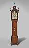 D.J. Tasma, Grouw, a monumental three train musical tall clock with full calendar, automata, and phases of the moon, mahogany case with molded base, fluted feet, canted corners, and carved bell flower molding with conforming marquetry band and central conch shell, the trunk with stop fluted half columns and Corinthian capitals, the door with carving and inlay matching the base, bonnet with stop fluted columns and Corinthian capitals below a pitched pediment with central carved basket of flowers, and three figural finials, brass composite dial with arcaded, silvered, roman numeral chapter ring, gilt spandrels, and engraved, matted center with calendar apertures, pierced blued steel hands, the arch with central moonphase aperture and polychrome painted landscape scene featuring two female musicians with lutes, their arms moving, as if to strum their instruments as the clock runs, and 8 day, three train, quarter striking musical movement, 7.5 inch cylinder playing 10 tunes on 12 bells, the quarters sounded on single bell, and striking the hours on a gong.