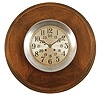 Chelsea Clock Co., Boston, Mass., wardroom clock, 8 day, time and ship's bells, spring-driven, balance wheel movement in a half-flush aluminum case with hinged bezel, partially recessed within a circular wooden wall mount, 7.5 inch silvered dial with inner ring showing 24 hour time, recessed electrical terminals to connect amplification for internal bell, movement serial number 559141.
