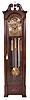 Herschede Clock Co., Cincinnati, OH, 8 day, three-train, chiming, weight-driven movement playing Westminster on five tubes in a mahogany case flanked with fluted half-columns and broken pediment with center finial. Brass dial with silvered chapter ring, strike / silent selector, applied cast brass and engraved dial center and spandrels and moon phase, serial number 437470.