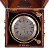 Neill Brothers, Belfast, two day marine chronometer, 10 jewel fusee movement with spotted plates, Earnshaw's escapement, freesprung, cut bimetallic balance, diamond endstone, and blued steel helical balance spring, Roman numeral silvered dial with wind indicator and gold spade and poker hands, with gimballed brass bowl, and contained in a three tier mahogany box with brass handles, serial #122