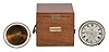 Eggert and Son, New York, a small two day marine chronometer, 10 jewel spotted movement, with bimetallic balance, helical balance spring, and adjustable gallows type stud, with inner, shock mounted dust cover in the manner of Parkinson & Frodsham, roman numeral silvered dial, gold spade and poker hands, contained in a lacquered brass bowl, together with a 19th century chronometer bowl, and another gimballed bowl with later, purpose made mahogany box