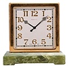 Switzerland, for Tiffany & Co., New York, a two sided desk clock, the rectangular green onyx base supporting the square, gilt case, silvered dials with applied, gilt arabic numerals, luminous black steel hands, 8 day, timepiece movement with lever escapement