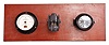 Seth Thomas Clock Co., Thomaston, Conn., "Mark-I Boat Clock", 8 day, time only, spring driven movement with rear wind in a black phenolic case with 3.5 inch black dial reading "U.S. Navy / 15485, 1941". The clock is mounted to a mahogany board with a barometer made by Fee & Stemwedel, dated 1942 and a compass made by Sherrill Research Corporation.