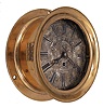 Chelsea Clock Co., Boston, Mass., for Ashcroft Mfg. Co., New York, deck or engine room clock, 8 day, time only, spring-driven jeweled balance wheel movement in a red brass case with hinged locking bezel, 8 inch silvered dial with with Roman numerals, an early Ashcroft trademark, and large letters reading "U.S.S. RALEIGH", black steel hands.
