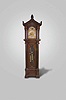 Herschede Hall Clock Co., Cincinnati Ohio for A.E. Siedle, Pittsburgh, Pennsylvania, "Pattern No. 99" hall clock, 8 day, time, strike and chime on five tubes signed Herschede Hall Clock Co., brass weight driven German movement in a carved mahogany case with full reeded Corinthian columns on the hood (in tandem) and the trunk door, beveled glasses on sides of hood and oval trunk door, carved large paw feet and trim on gabled top. The brass dial is signed by Pittsburgh retailer and has moon phase, silvered chapter ring with applied brass numerals and chime / silent and strike / silent selectors.
