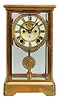 Ansonia Clock Co., New York, "Prism" crystal regulator shelf clock with a spring driven, 8 day, time and half hour strike movement with visible escapement, a jeweled sash and pendulum bob in a polished brass cased with beveled glass door and side panels.