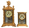 Clocks- 2 (Two): (1) William L. Gilbert Clock Co., Winsted, Conn., "Verdi", 8 day, time and strike, spring brass movement crystal regulator with visible escapement, c1906 (2) Waterbury Clock Co., Waterbury, Conn., "Navarre", 8 day, time and strike, spring brass movement crystal regulator with visible escapement, c1906
