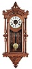 F. Kroeber Clock Co., New York, "Regulator No. 30" wall hanging clock with an E. N. Welch spring driven, 8 day, timepiece movement in a walnut case with burl accents.