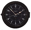 Chelsea Clock Co., Boston, Mass., "12E Deck & Engine Room Clock", 8 day, time only, spring driven movement with jeweled lever escapement and center seconds in a black phenolic case with hinged bezel, 8.5 inch black dial signed by the maker and with "U.S. Navy", 12 and 24 hour markers, white spade hands, movement serial number 785464, c1974.