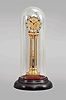 Asian, modern reproduction fusee skeleton clock under glass dome, 8 day, time only exposed movement powered by an extended coiled spring, silvered chapter ring reading "WU Smith, Musselburgh / Maker & Inventor", mounted on a velvet-covered black molded base, late 20th century.