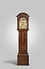 T. Clare, Hatton, England, tall clock, 8 day, time, strike and chime on a nest of six bells, weight driven movement in a inlaid mahogany case with four fluted columns flanking hood. The trunk has a shaped crotch mahogany door flanked by fluted quarter columns with gold painted capitals over a crotch mahogany base framed by string inlay and contrasting mahogany veneer. The brass dial has silvered chapter ring, moon phase, maker's signature, silvered second's bit and calendar aperture.
