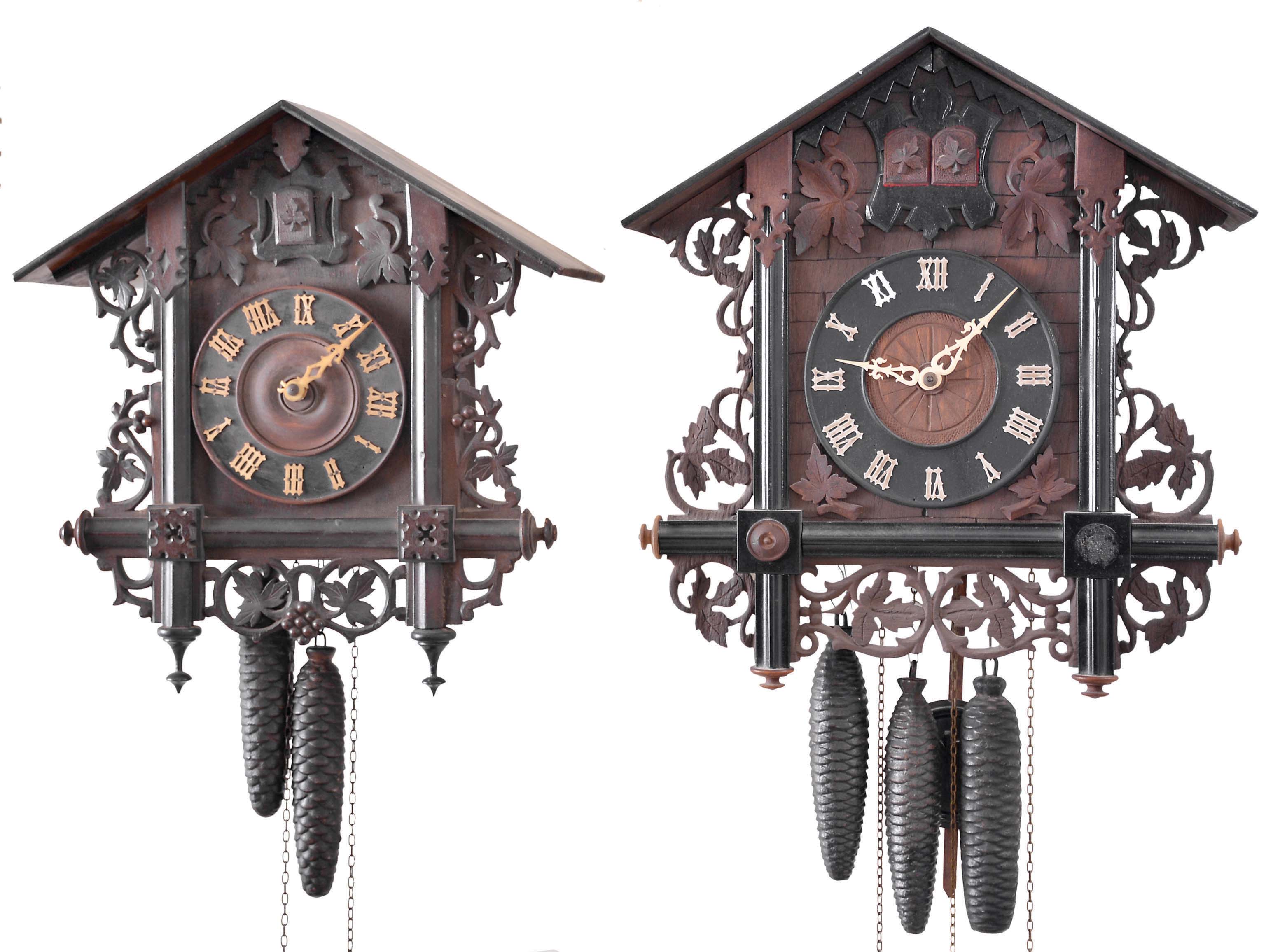 Clocks- 6 (Six) German Cuckoo: assortment of Black Forest cuckoo clocks including 4 two-weight clocks and 2 three-weight cuckoo and quail clocks. One of the two cuckoo and quail clocks has a wood plate movement. Makers include: George Kuehl Clock Co. (G.K.), American Cuckoo Clock Company, and others. — Antique Clocks Price Guide