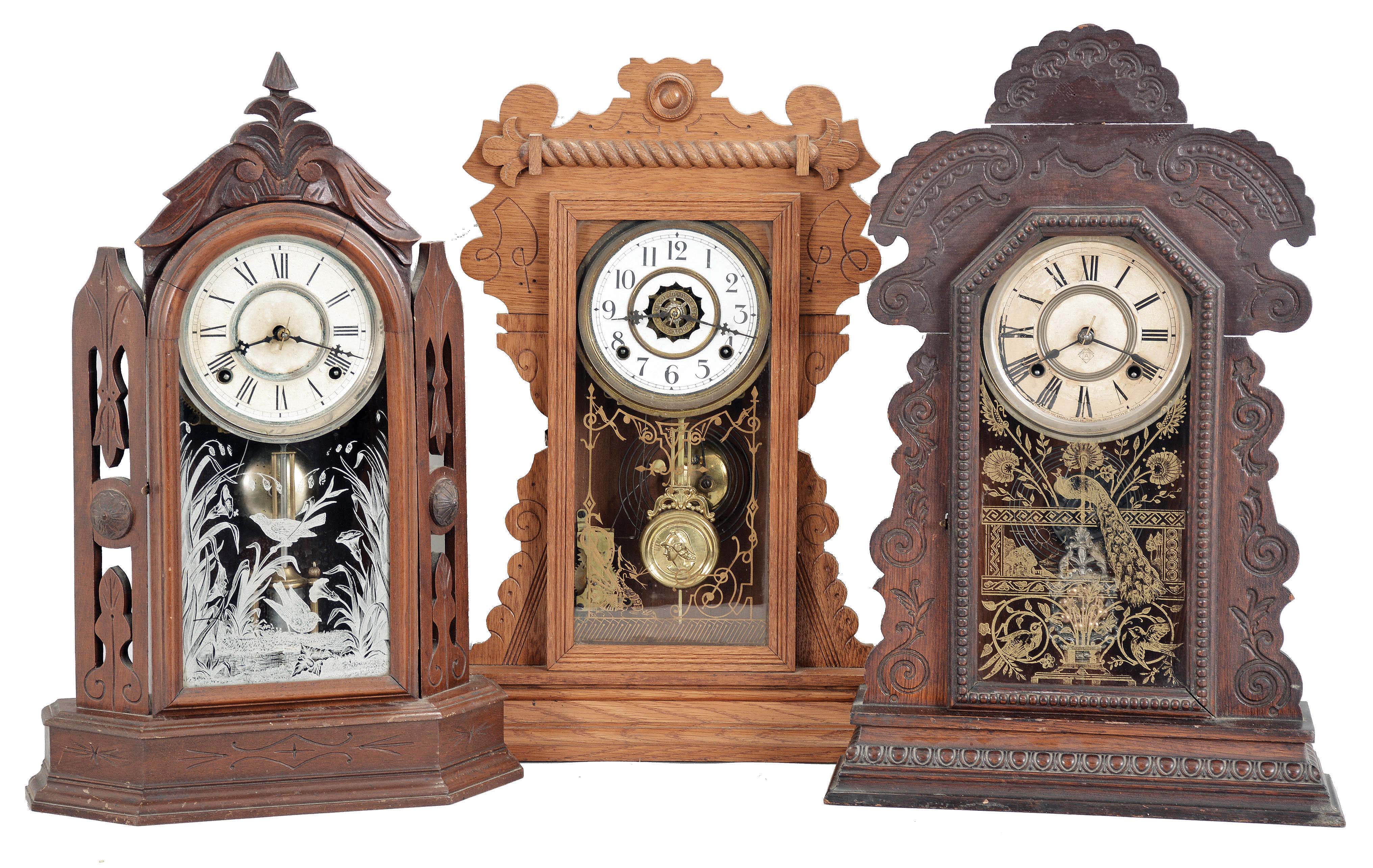 Clocks- 3 (Three): (1) William L. Gilbert Clock Co., Winsted, Conn., "Turret", 8 day, time and strike, spring brass movement shelf clock, c1881 (2) Waterbury Clock Co., Waterbury, Conn., "Mansfield", 8 day, time and strike, spring brass movement shelf clock, c1891 (3) Ansonia Clock Co., New York, "Kenisco", 8 day, time and strike, spring brass movement shelf clock, c1901 — Antique Clocks Price Guide